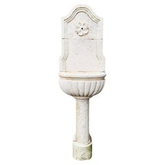 Antique French Wall Fountain made of light Limestone