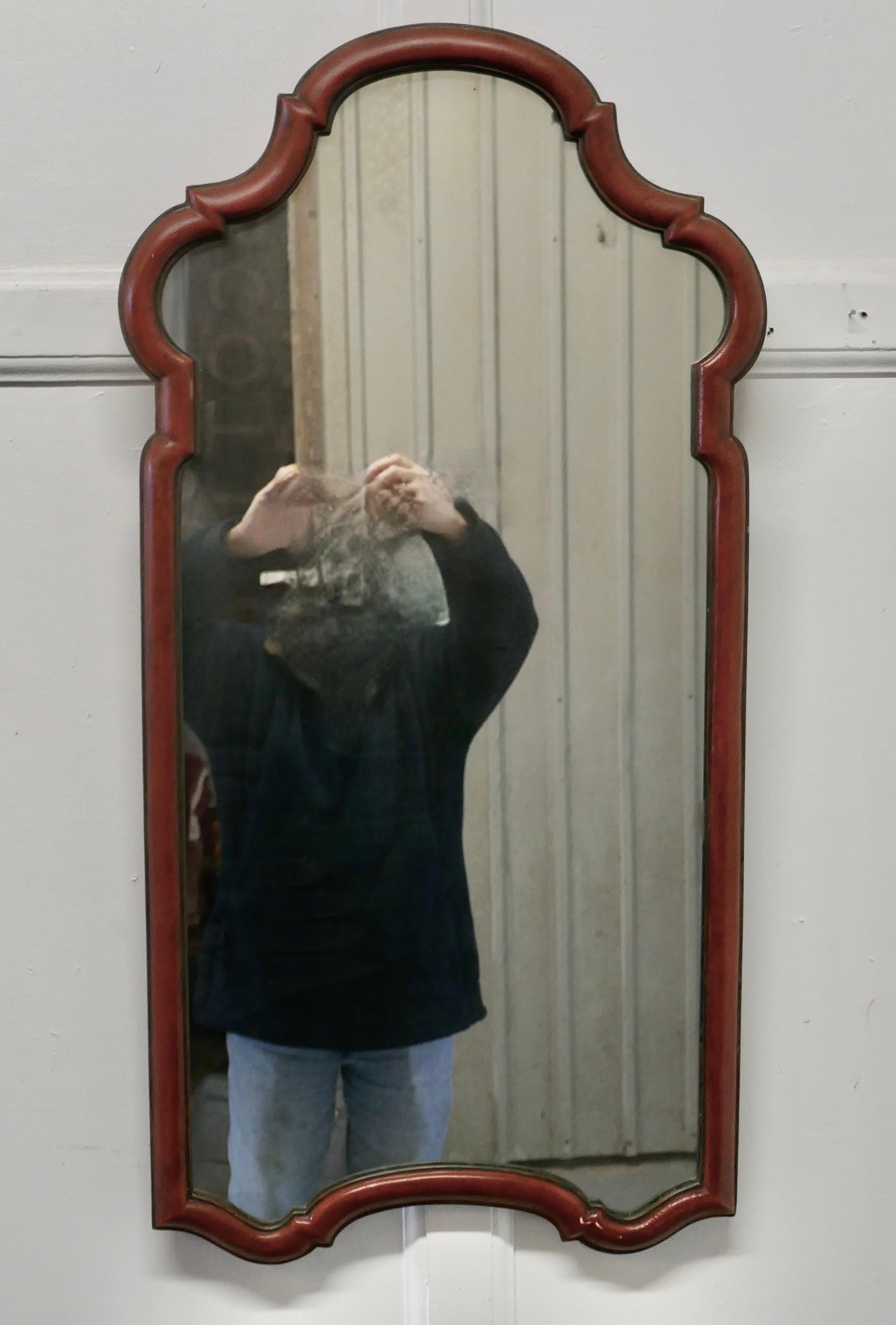 French wall mirror
 
This is a lovely French mirror, the 1.5” moulded frame has a Serpentine Arch along the top and it has has a charming dark aged red finish with a green edge, it is sound as is the glass 
A lovely decorative piece
Measures:
