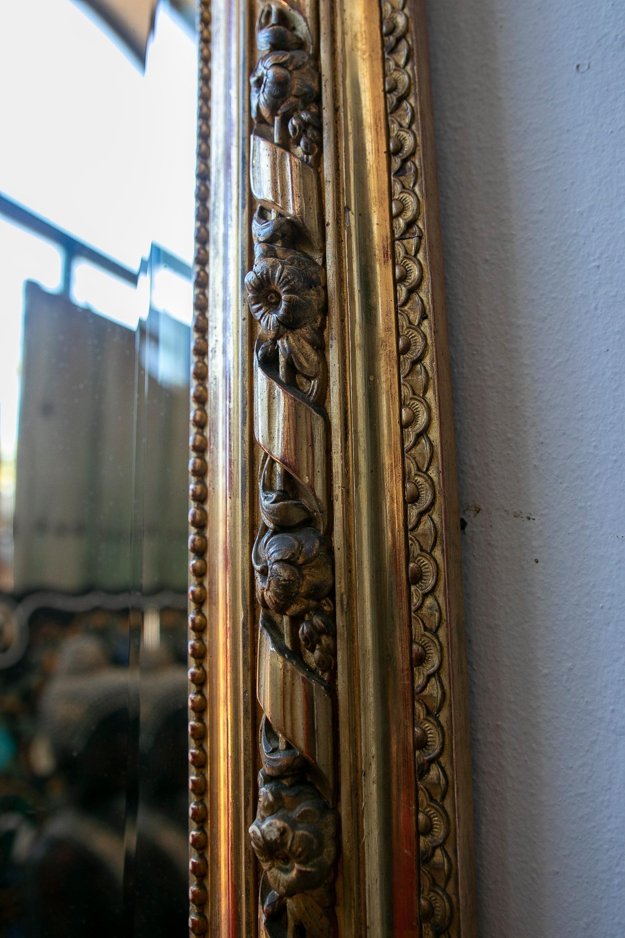 French Wall Mirror in Gilded Wood with the Coping Top Decorated with Instruments For Sale 2