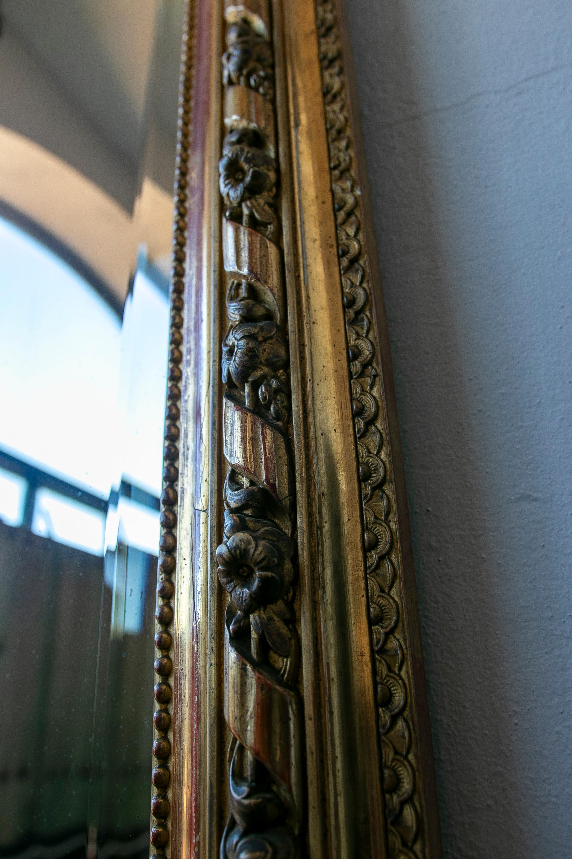 French Wall Mirror in Gilded Wood with the Coping Top Decorated with Instruments For Sale 3
