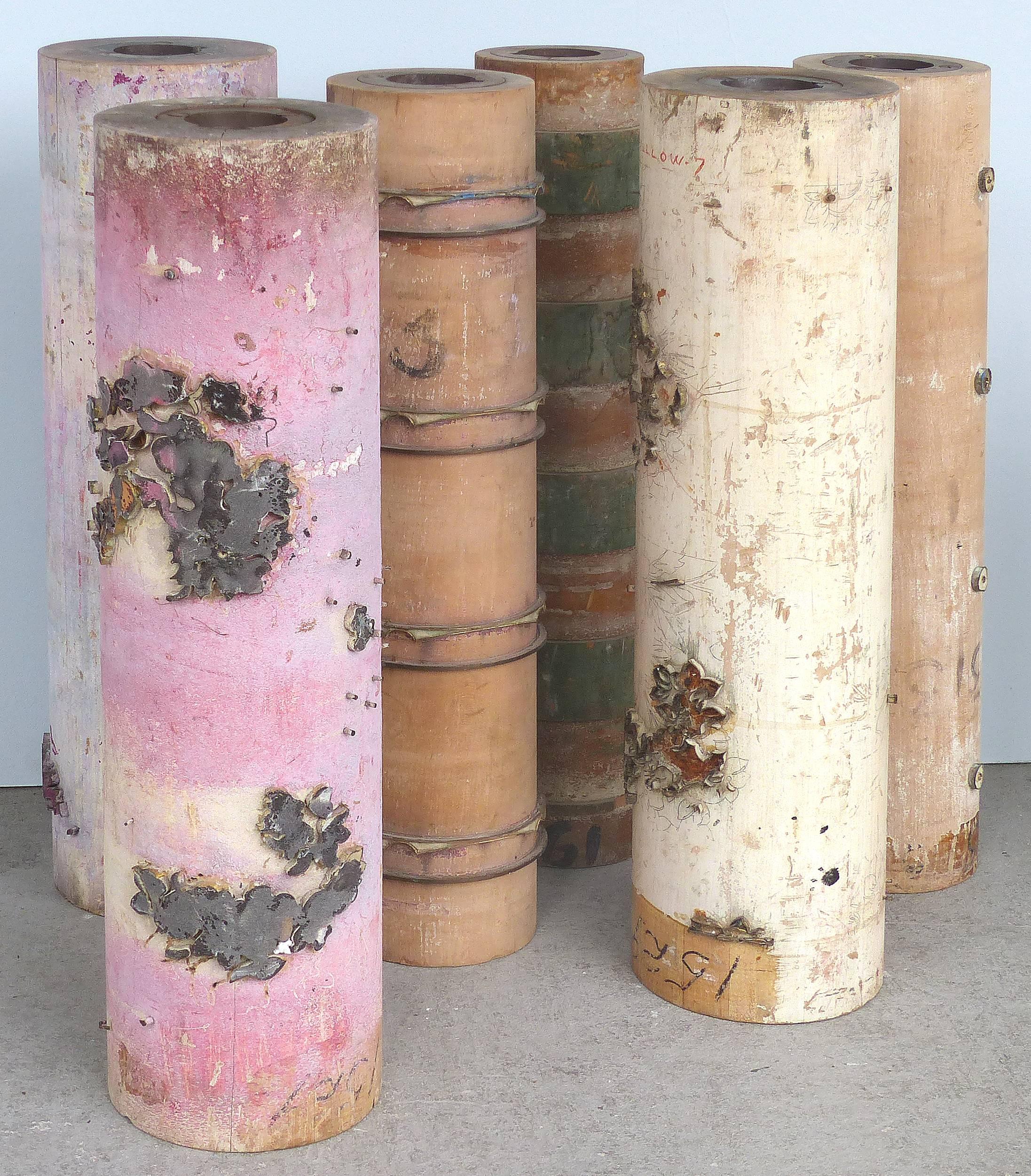 Offered for sale are four individual vintage French wallpaper rollers used to create the different coloring of rolls of paper. These cylinders are slightly rustic and quite charming. They are popular for use when creating table lamp bases. They