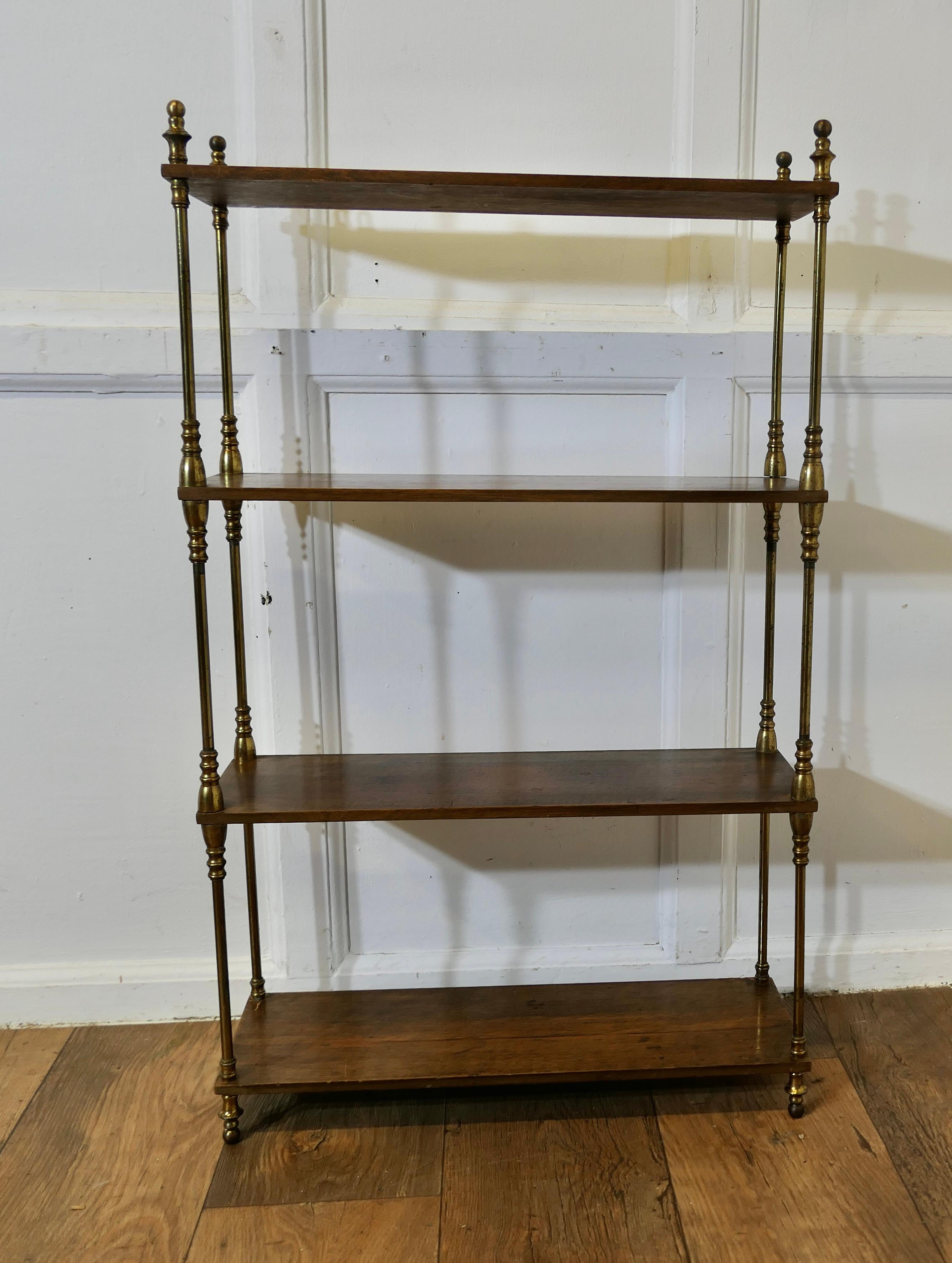 French Walnut and Brass Open Shelf  Unit

The shelf or étagère is free standing with 4 open shelves connected with turned brass upright columns
The shelf is 36” high overall, 22” wide and 8” deep
TCS154