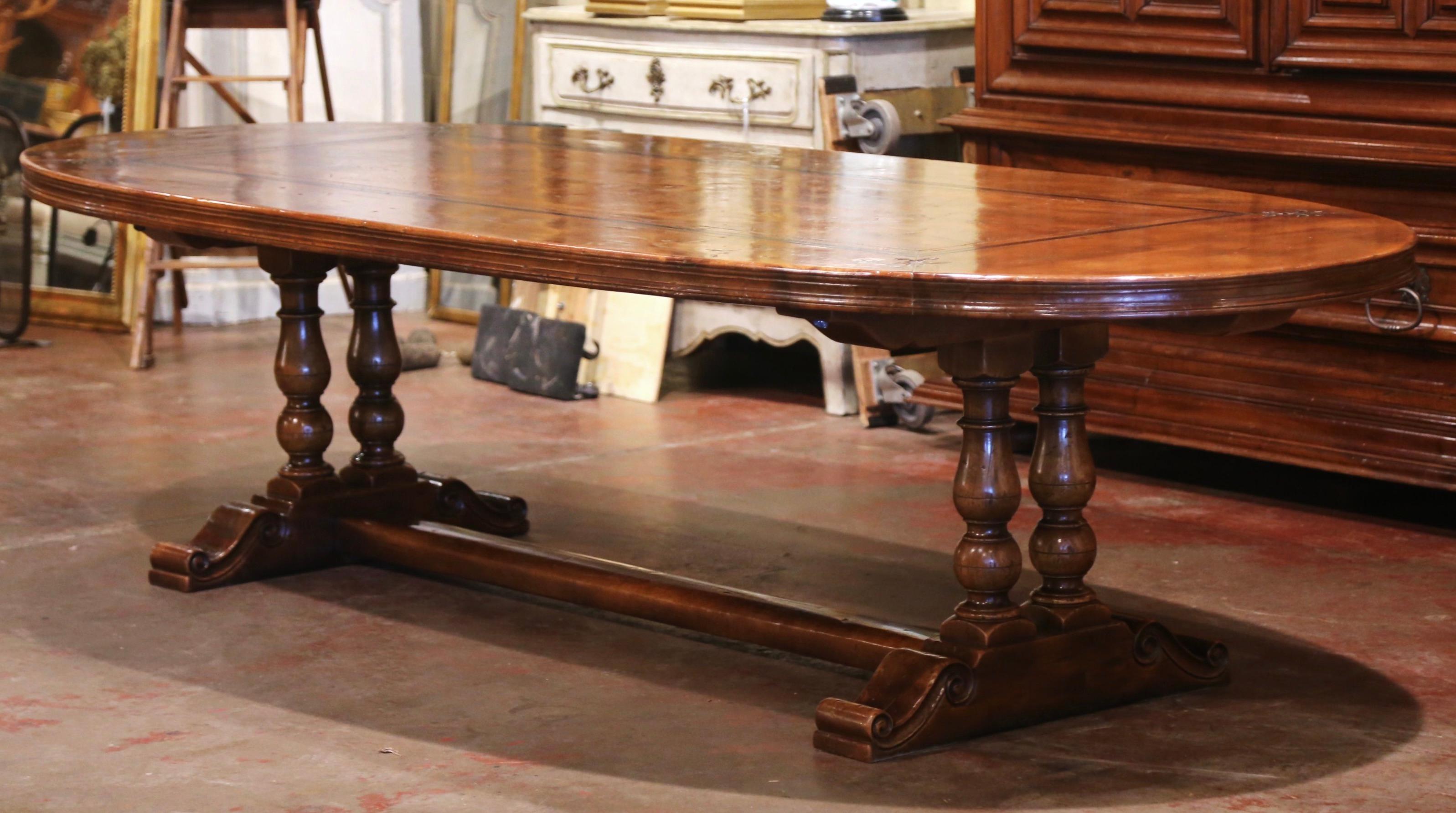 Hand-Carved French Walnut and Chestnut Oval Trestle Dining Table with Fleur de Lys Decor