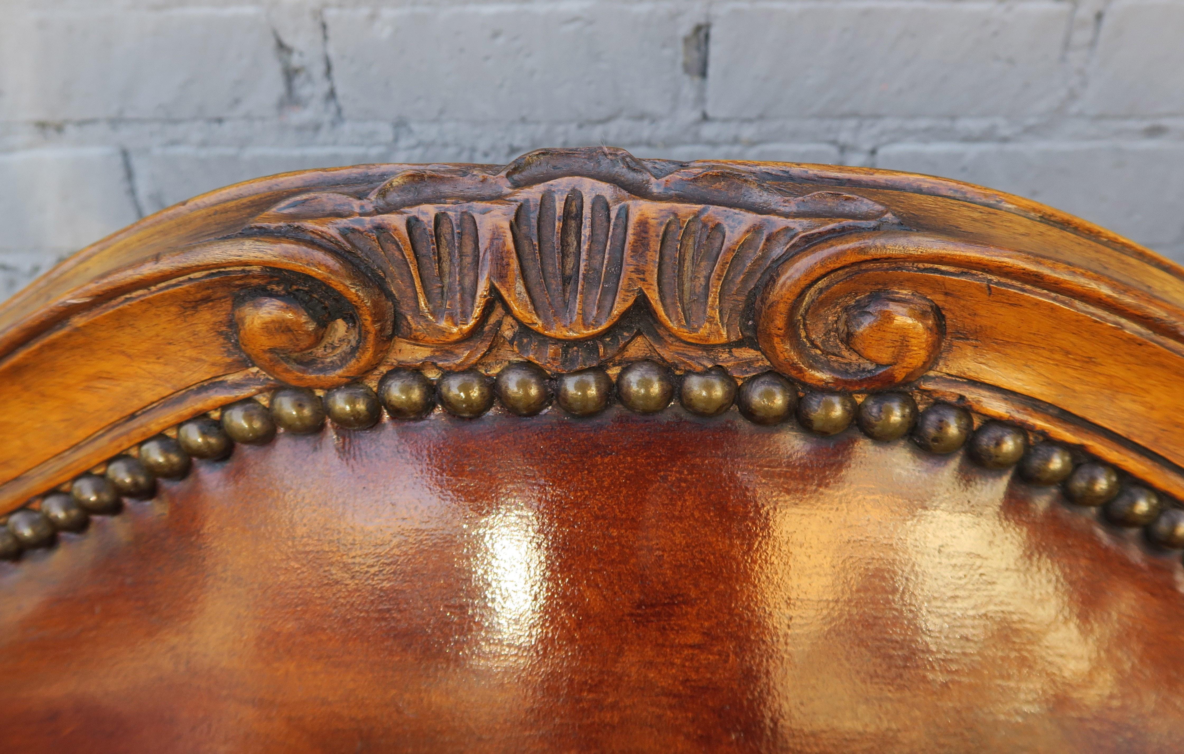 Early 20th Century French Walnut Carved Leather Armchairs, Pair