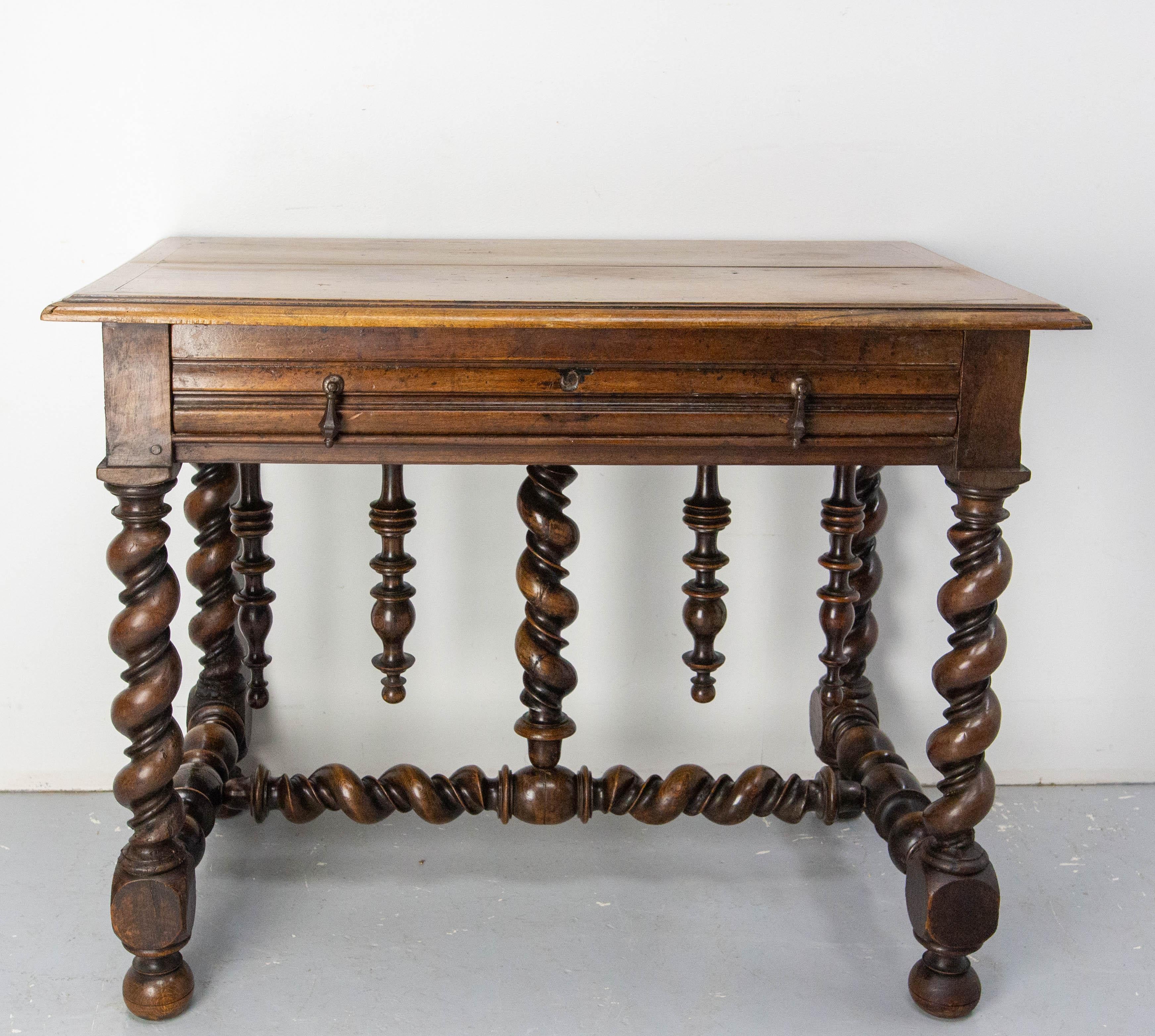 French desk or side table, made circa 1660
Massive walnut and iron handles.
Nice antique patina.
The turned legs and bars are typical of the Louis XIII style.
Legroom height and depth : 23.62 in. & 9.84 in.  (H: 60 cm D: 25 cm)
Good