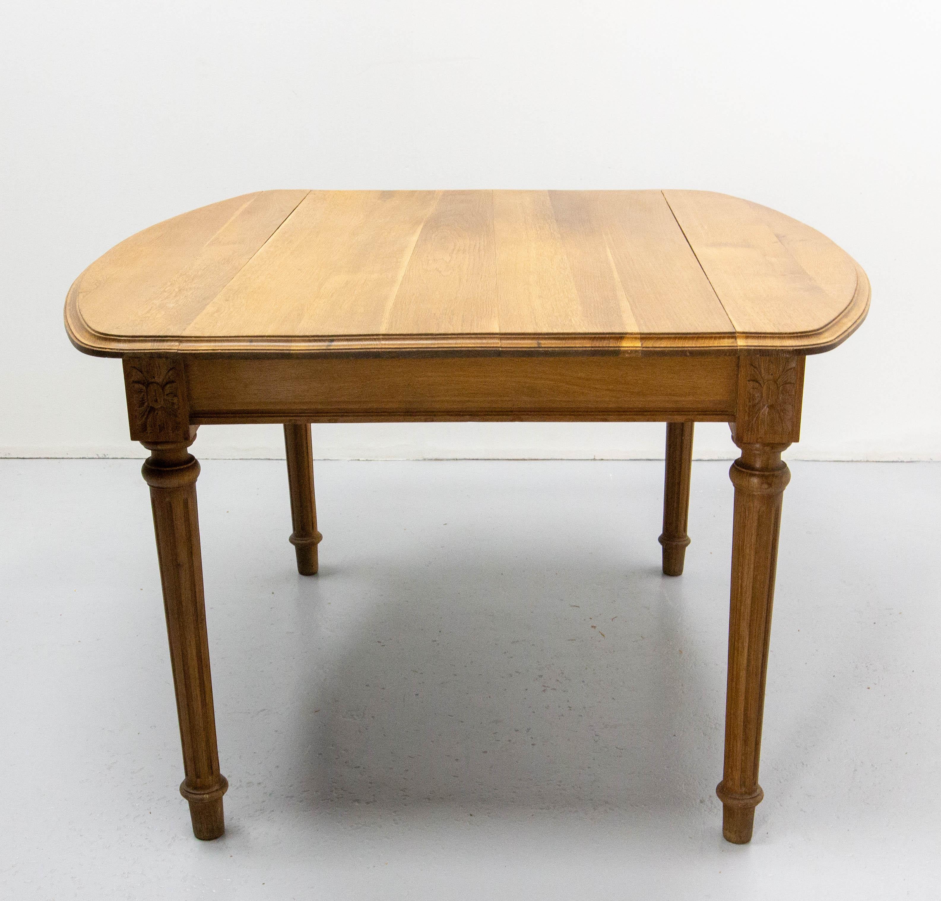 This walnut dining table in the Louis XVI style was made in France.
Without the extensions this table is 44.46 in. (112 cm) long with the extensions it measures 75.39 in. (191.5 cm)
The extensions of the table are the originals they were not made in