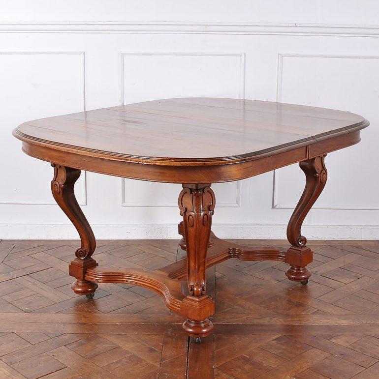French walnut dining table in the Art Nouveau style. Distinctive hand carving on the legs, stretcher, and base. From the late 1800s. No leaves, but they can be made. Table extends to a full 124 inches – over 10 feet long.



  