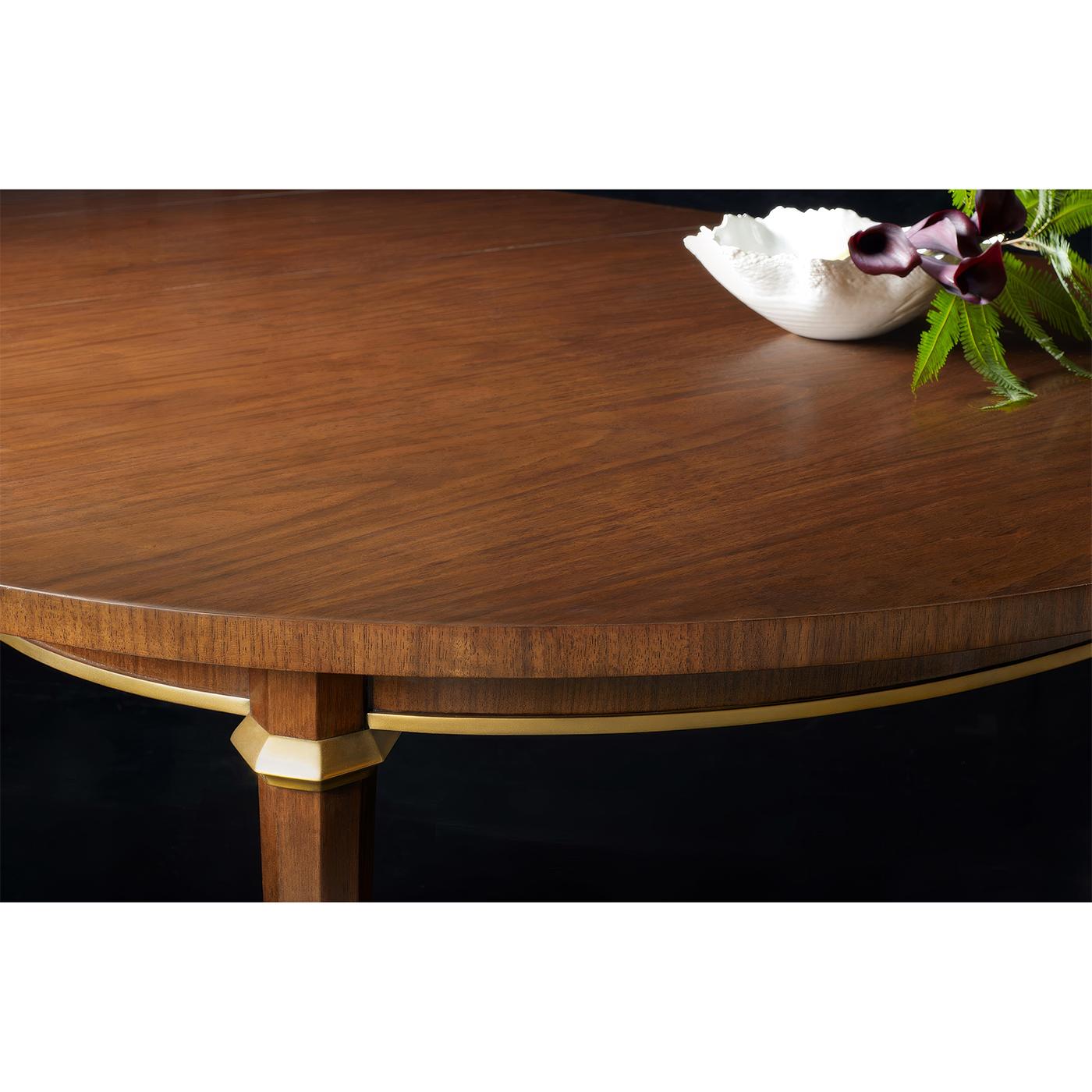 Crafted with hand-rubbed walnut veneer, this extension dining table showcases an exquisite balance of traditional craftsmanship and modern versatility. The rich walnut grain is complemented by delicate brass trim, ensuring a luxurious aesthetic that