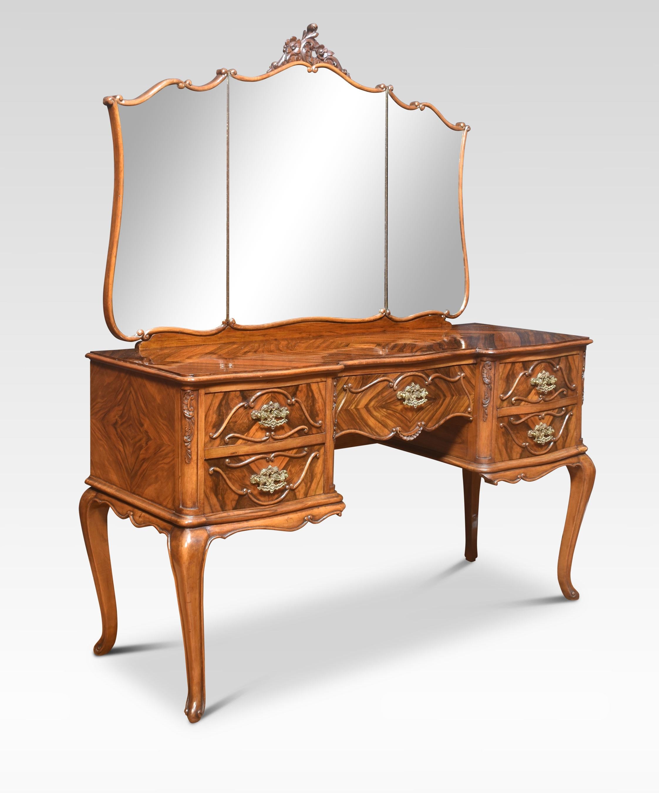 Walnut dressing table the original adjustable three mirror plate above well-figured top to an arrangement of drawers with brass tooled handles. All raised up on slender cabriolet supports.
Dimensions
Height 63 inches
Width 53.5 inches
Depth