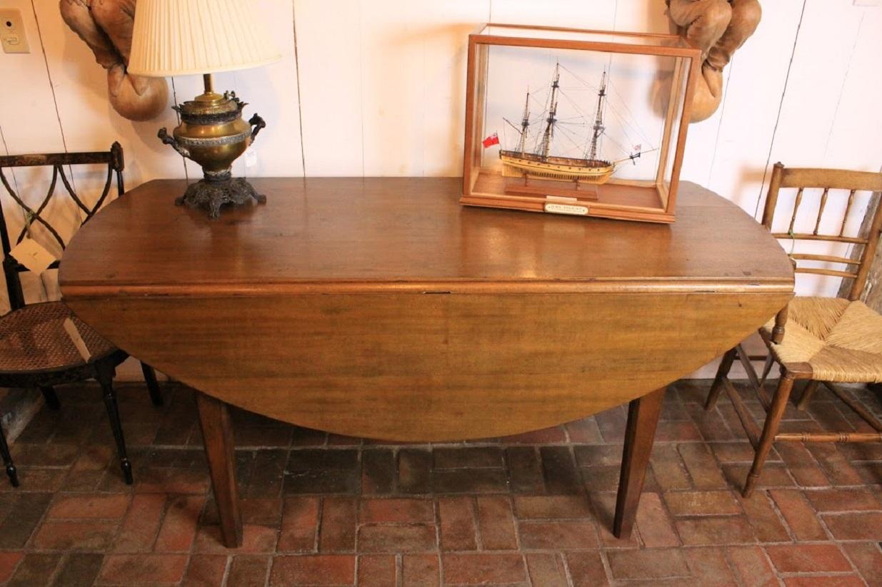 19th century French walnut drop leaf table with peg construction. Leaves measure 15