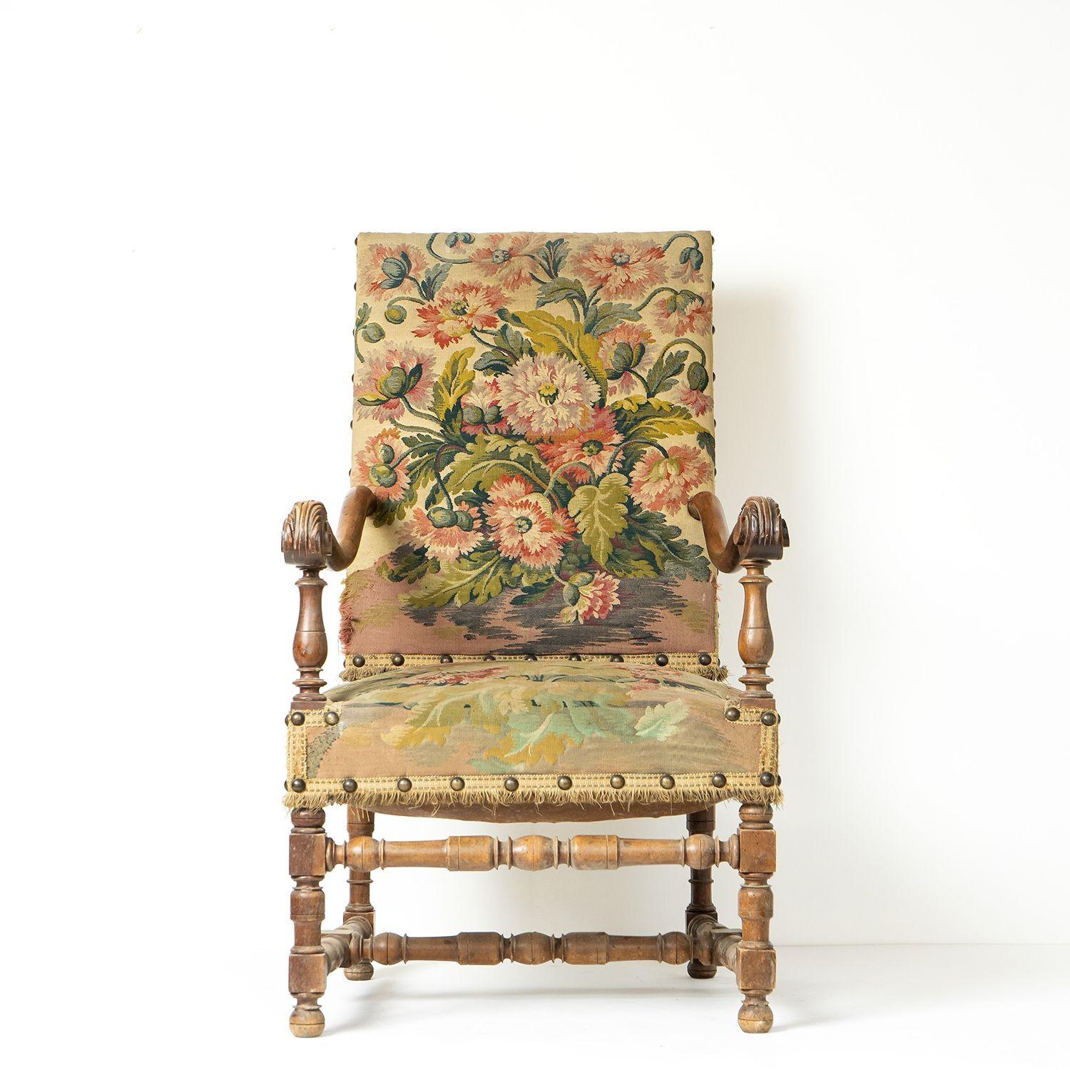Large Antique Upholstered Fauteuil Open Armchair

A generous seat with its original floral tapestry upholstery depicting a spray of fancy poppies and poppy heads.

Carved walnut arms sweeping to great effect with turned walnut legs and