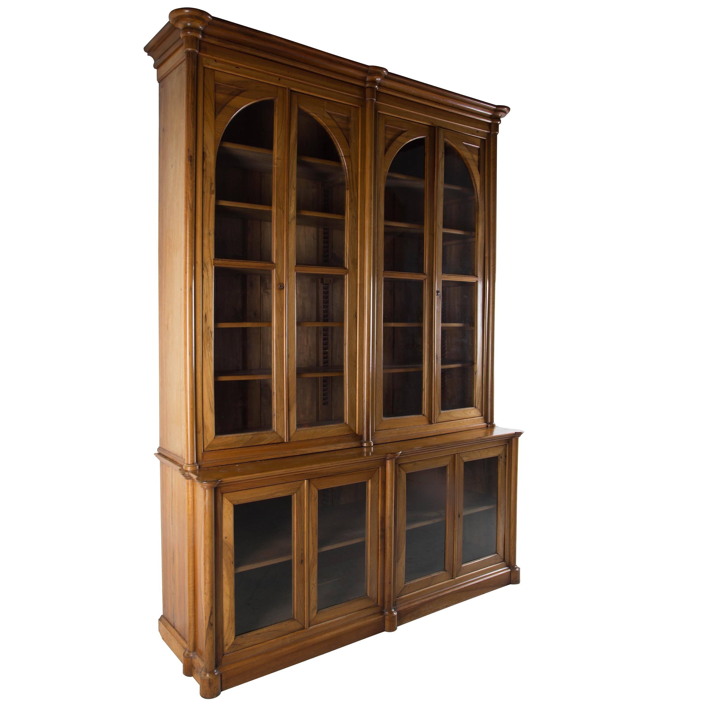 A handsome and very well proportioned solid walnut French bookcase in Empire style, circa 1890. A handsome and impressive statement piece with well figured timbers.