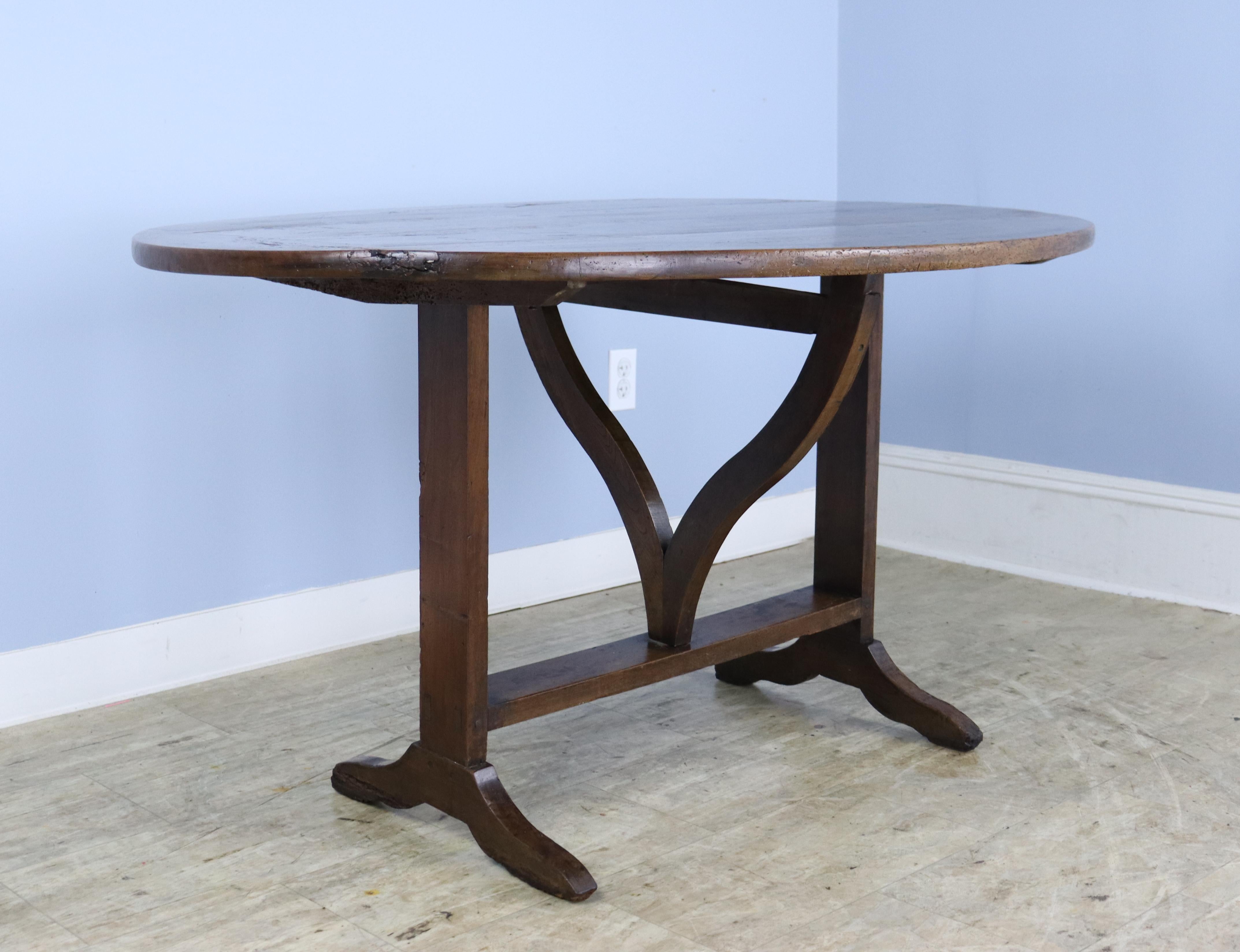 With a width of 51.5 inches, this lovely oval table will provide good seating for a small group, and has the advantage of not having an apron to get in the way of knees or chairs. The vendange table, typically used in the wine tasting room at the