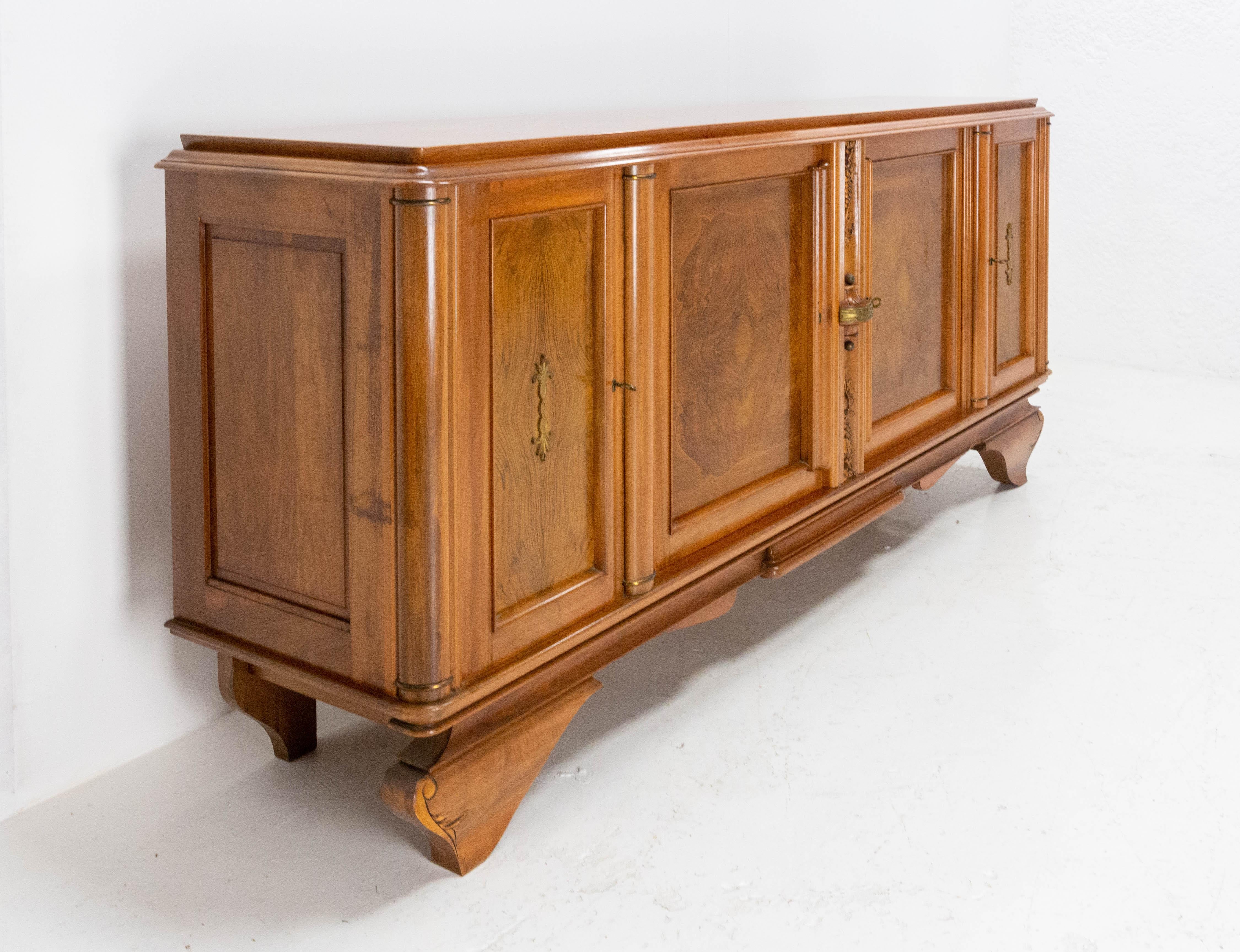 Midcentury credenza sideboard French buffet circa 1960
Four doors and two inside drawers
Solid walnut
In good condition 

Shipping:
wooden case 234,00 69,00 62,00 cm 165  kg.