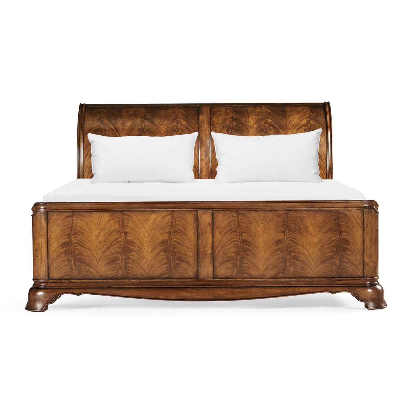 Crotch walnut sleigh bed after the French style, with high sloping headboard and low foot end, carved molded frame and apron all on kick-out bracket feet.

Dimensions: 84.25