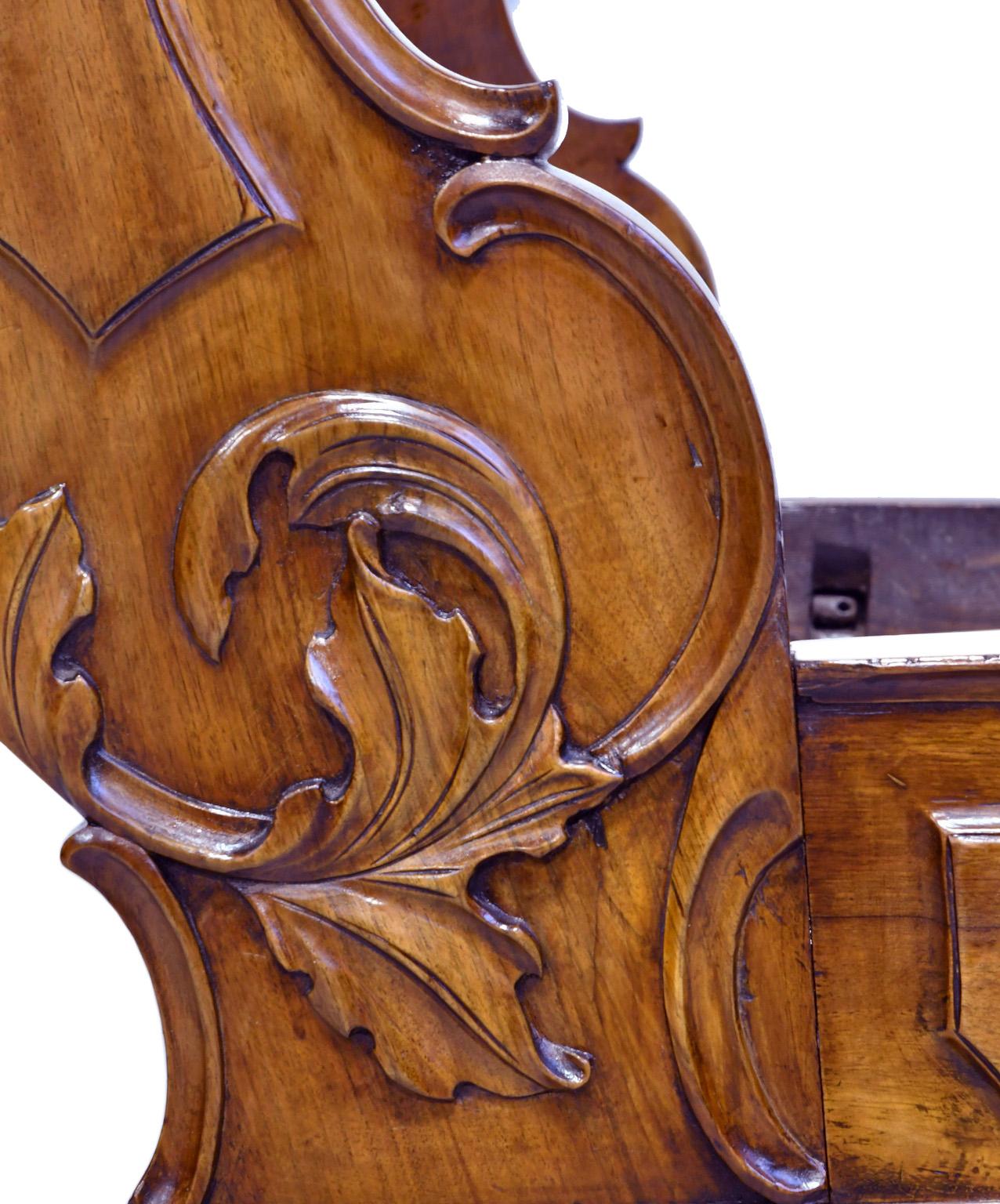 Polished French Walnut Sleigh Day Bed with Articulated Carvings in a Provincial Style