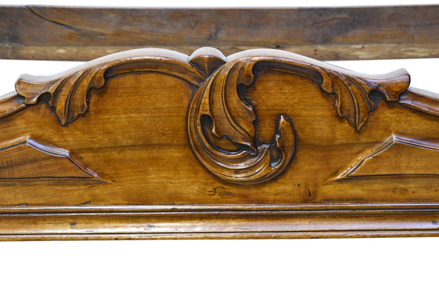 Mid-19th Century French Walnut Sleigh Day Bed with Articulated Carvings in a Provincial Style