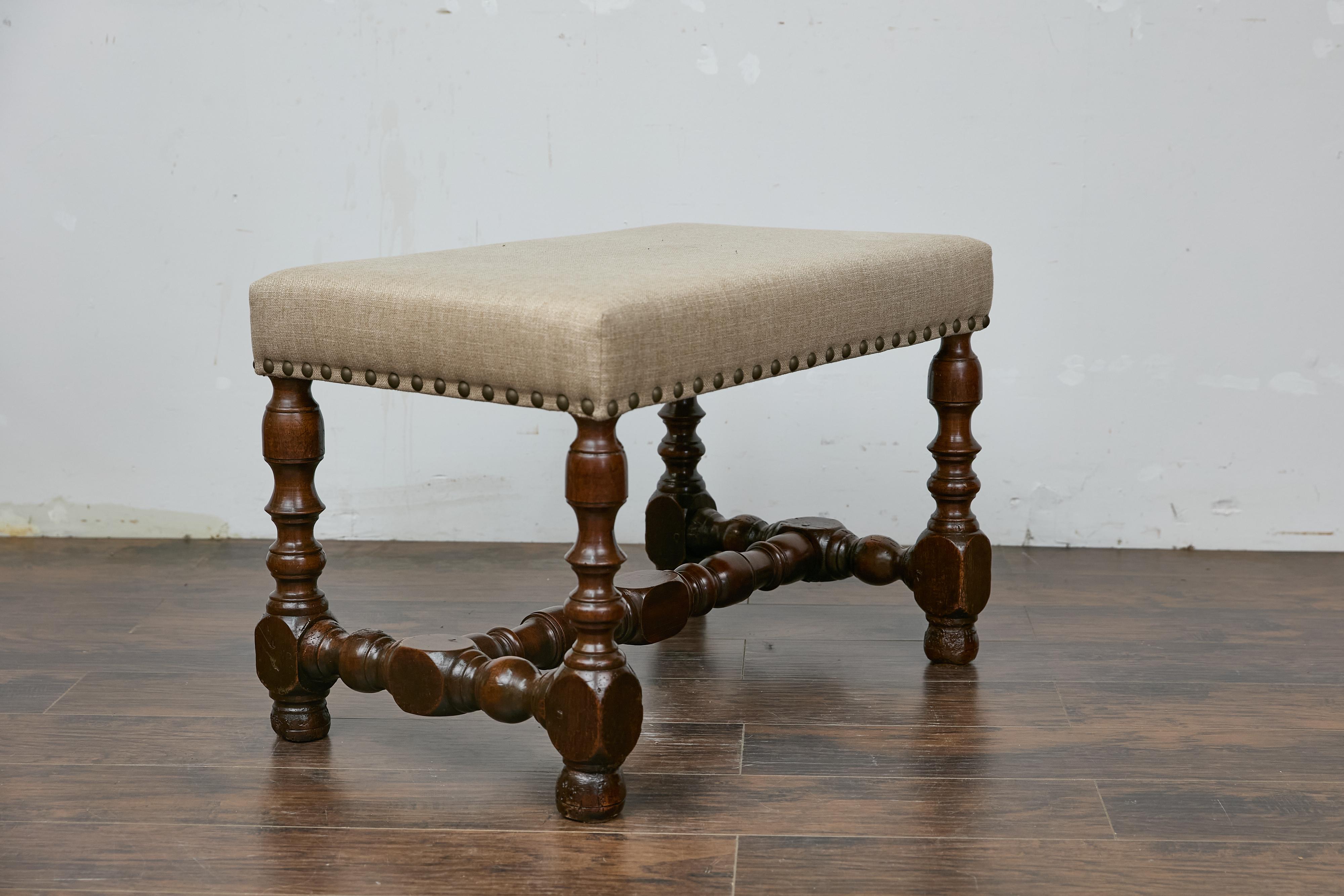Brass French Walnut Stool with Turned Legs, Linen Upholstery, and Nailhead Trim