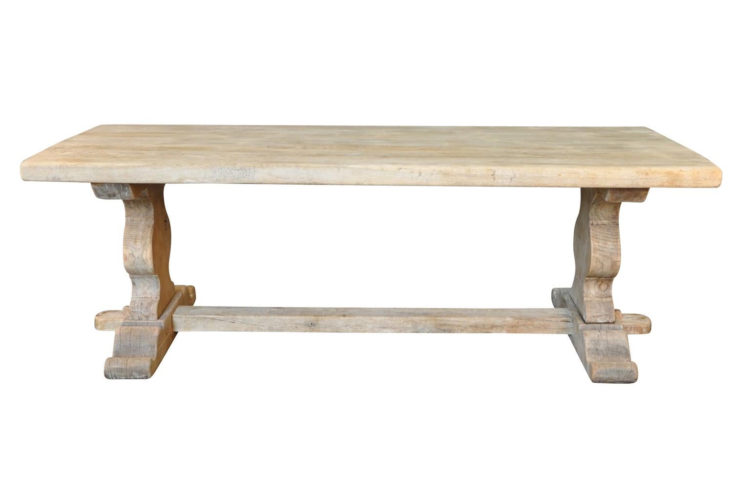 A very nice early 20th century farm table, trestle table from the Provence region of France. Soundly constructed from washed or bleached oak. Wonderful not only as a dining table, but as a large sofa table or writing desk.