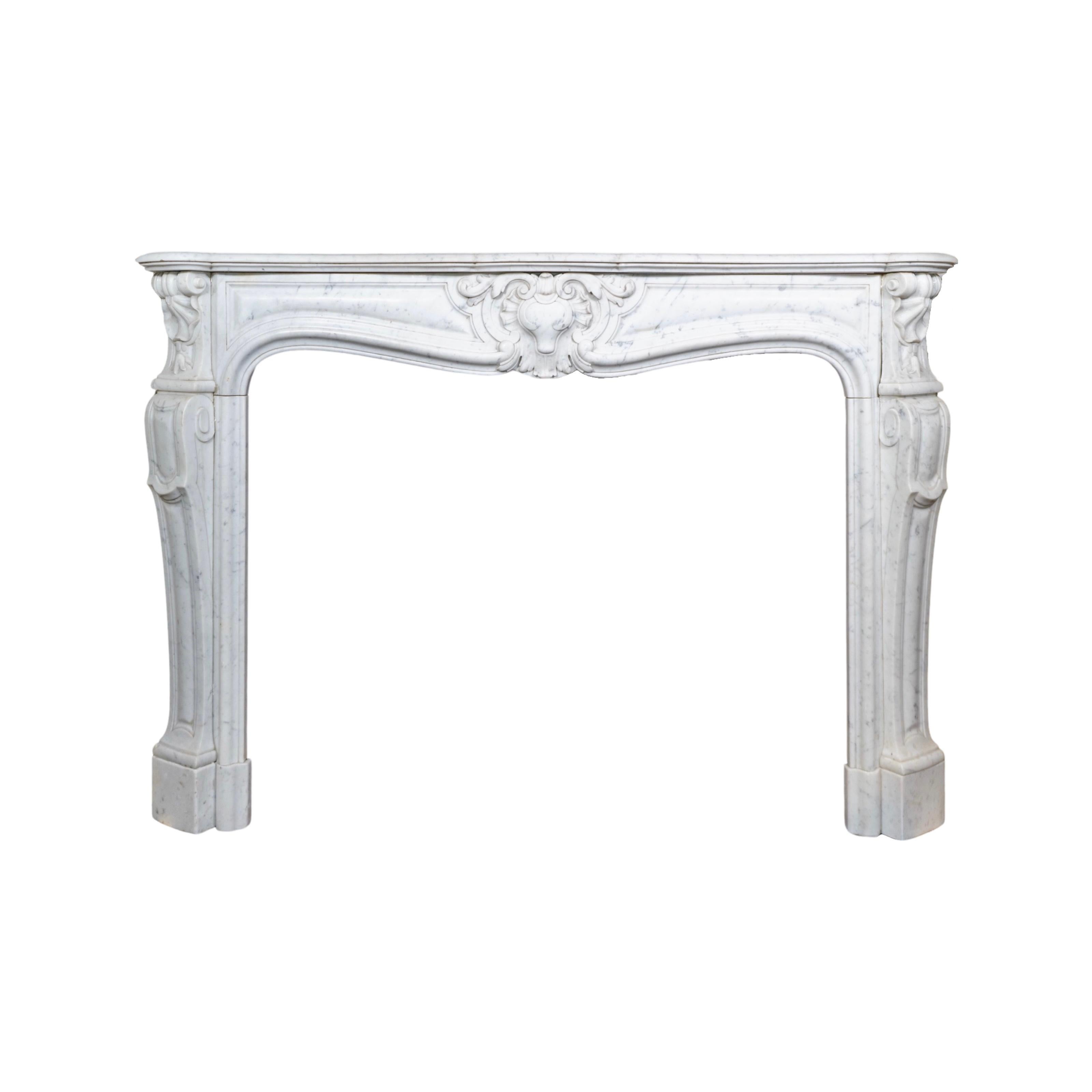 This French White Carrara Marble Mantel, made in the 1890s from high-quality Carrara marble from France, features intricate style carvings and built-in air vents on both sides of the legs. The perfect addition to any fireplace, this mantel offers