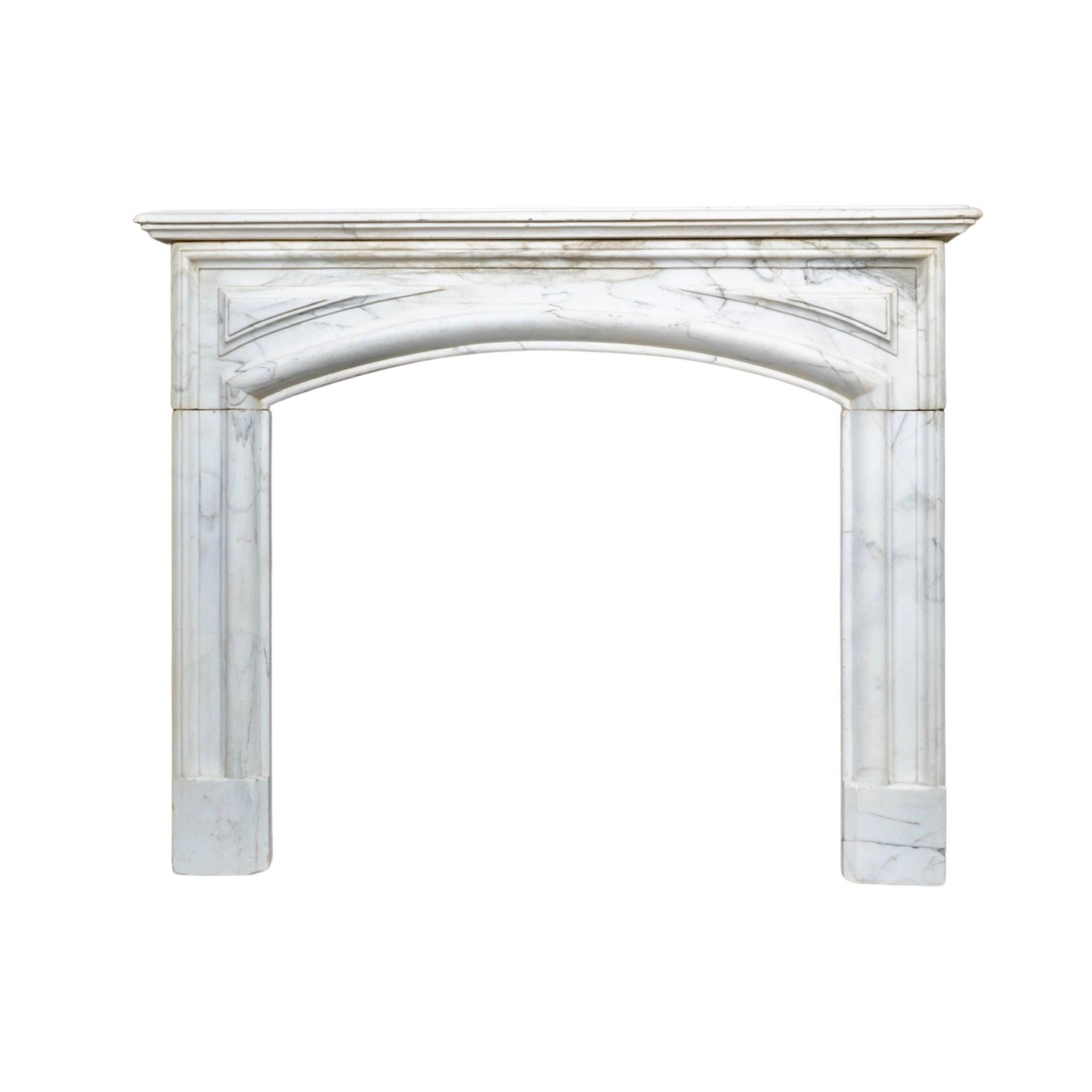 This white Carrara marble mantel, from 1890's France, boasts elegant bolection-style carvings. Crafted with the finest Carrara marble, this mantel adds a touch of sophistication and history to any room. Expertly made and exquisite in design, this