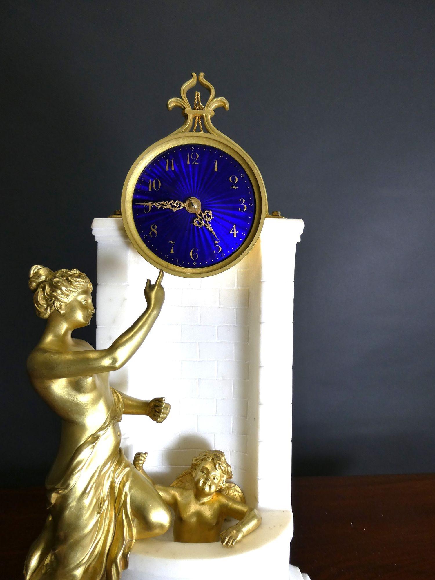 French White Marble and Ormolu Mantel Clock
Housed in a white marble figural case depicting a wall fountain with Cupid in the basin and Venus standing beside indicating the time, surmounted by a decorative ormolu mount.
Fine blue dial with gilded