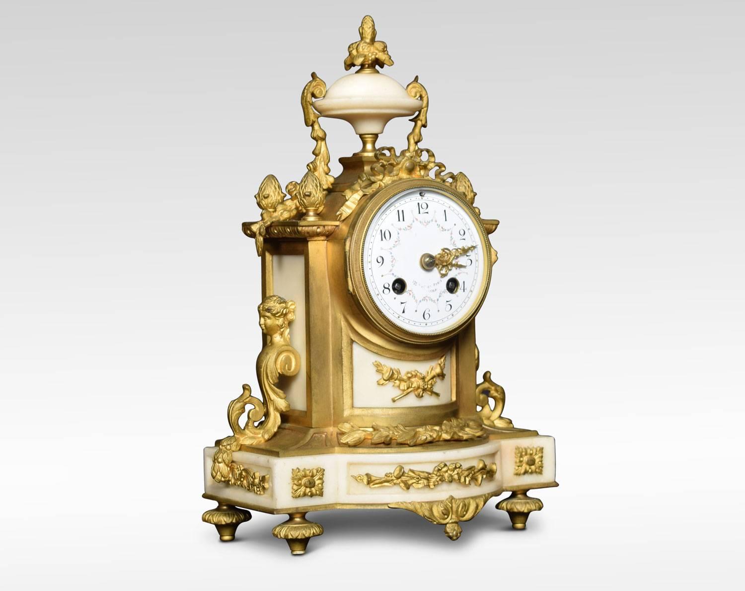 The clock having a 3.5-inch dial with white-enameled chapter ring and floral painted dial, the two-train Mougin eight day movement striking on a bell, the clock housed in white marble case summoned with scrolling maddens and acorn finials. All