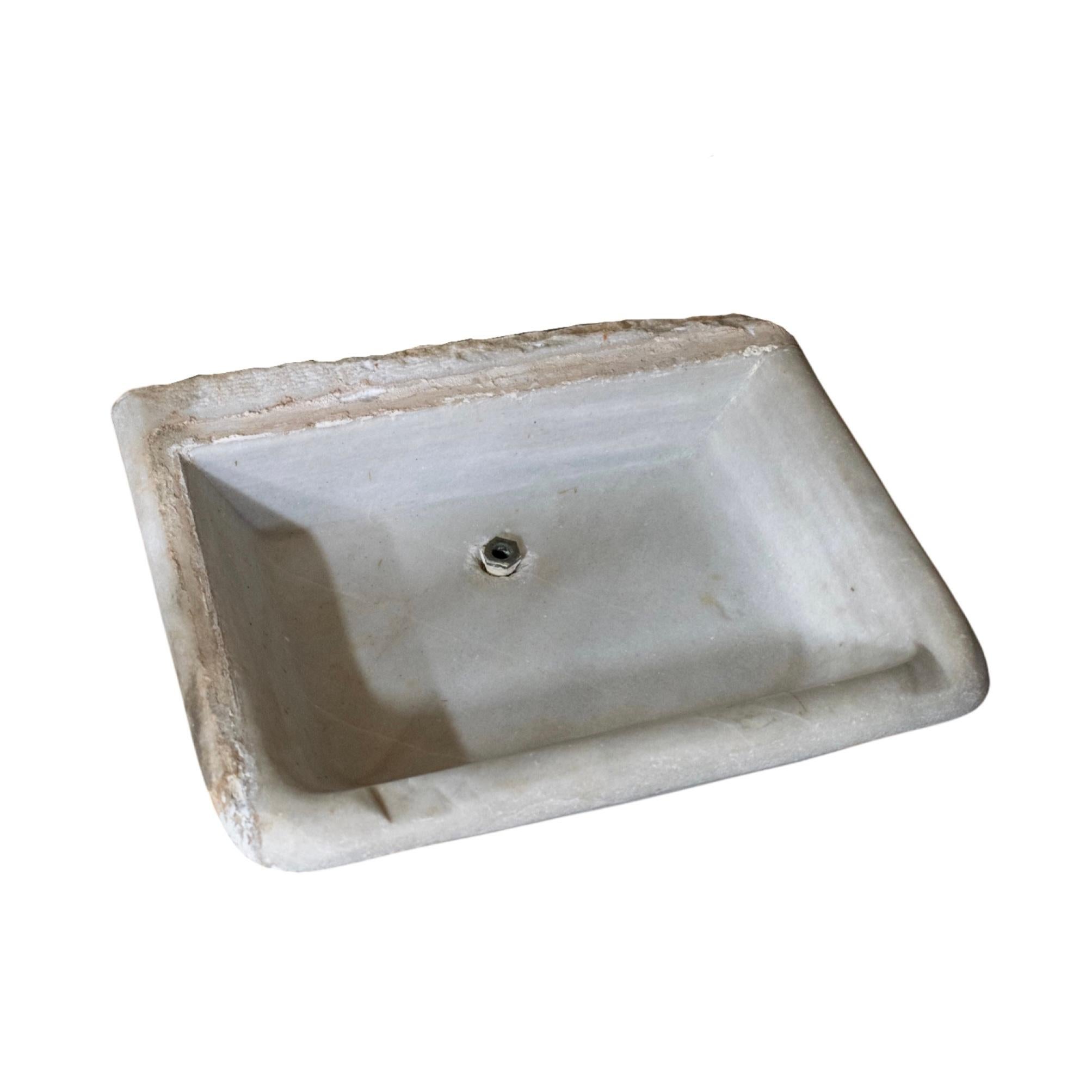 Small sink made out of white Marble stone. Originates from France. Circa, 19th c.