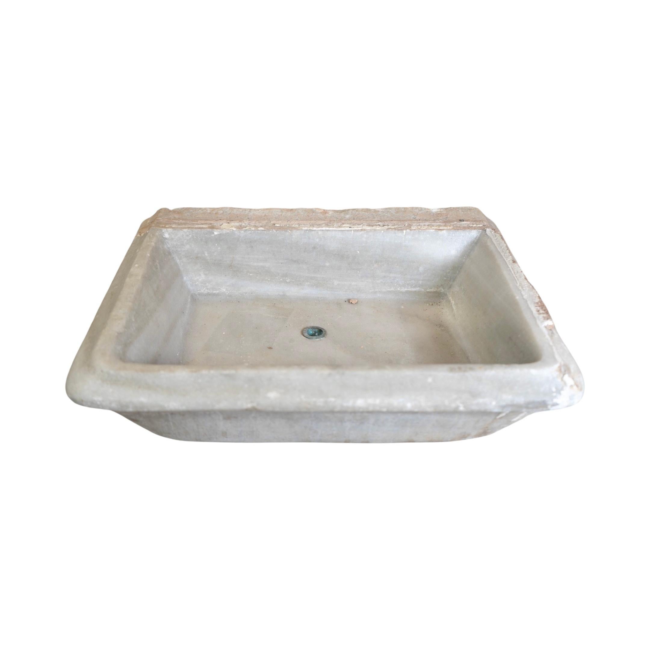 Made from exquisite Carrara Marble from France, this vintage 19th-century sink adds a touch of elegance to any space. Its small square shape is perfect for compact bathrooms and its durable stone construction ensures lasting beauty. Upgrade your