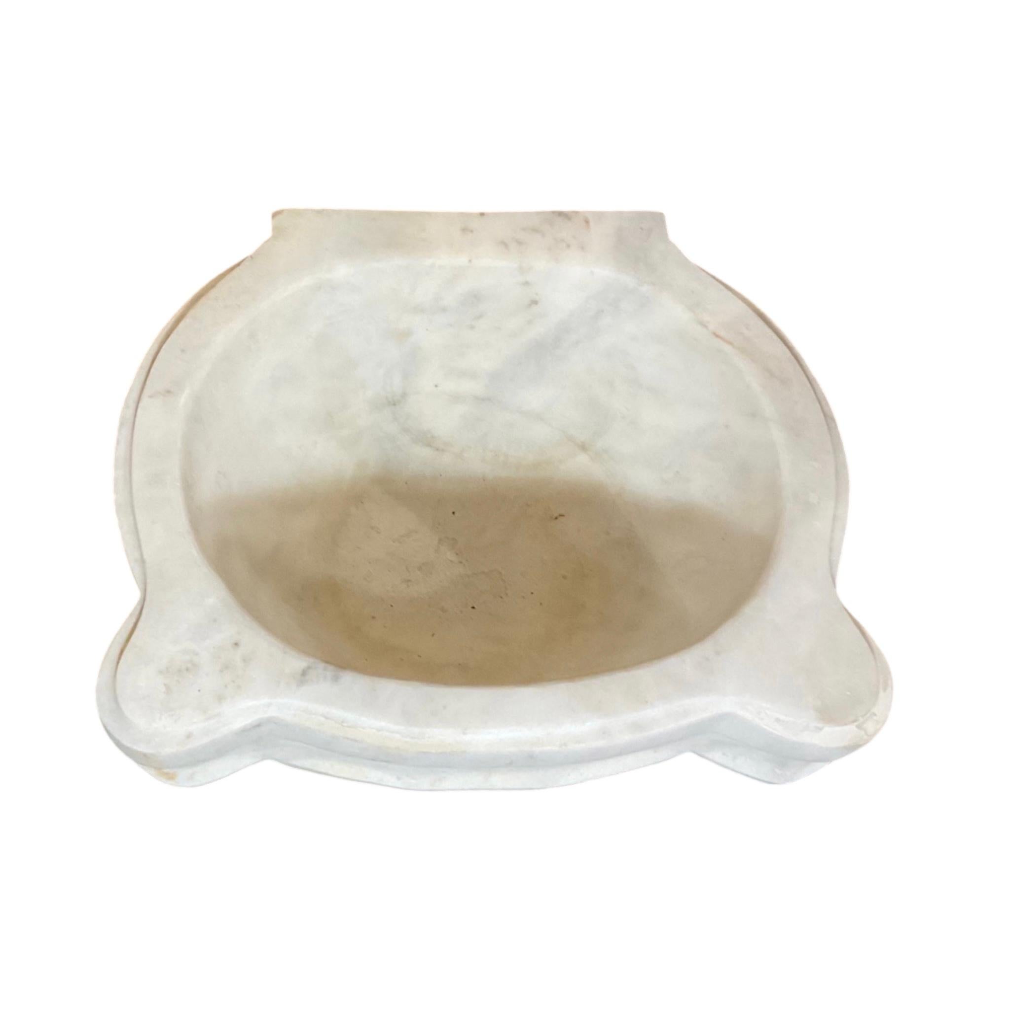 This high-quality French White Marble Sink is an authentic reproduction from the 18th century. It is crafted from luxurious marble and offers superior strength, durability, and aesthetic appeal. Its timeless design and superior material make it an