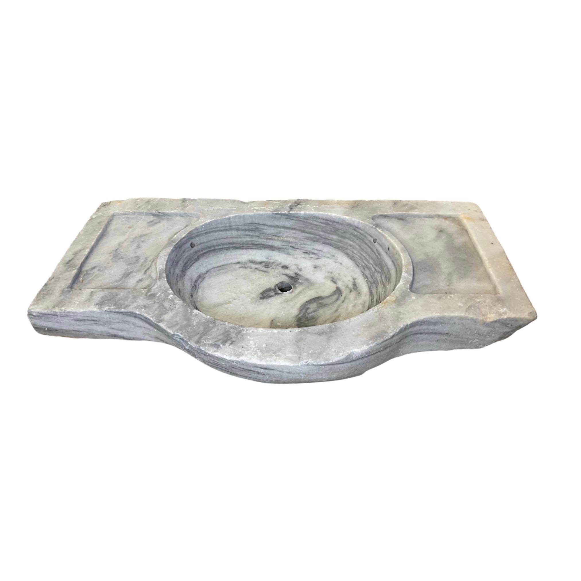 Our French white marble sink is a timeless piece of luxury, featuring a traditional 18th century design that guarantees unrivalled elegance and durability. Crafted from rare and beautiful white marble, it is sure to add a touch of sophistication to