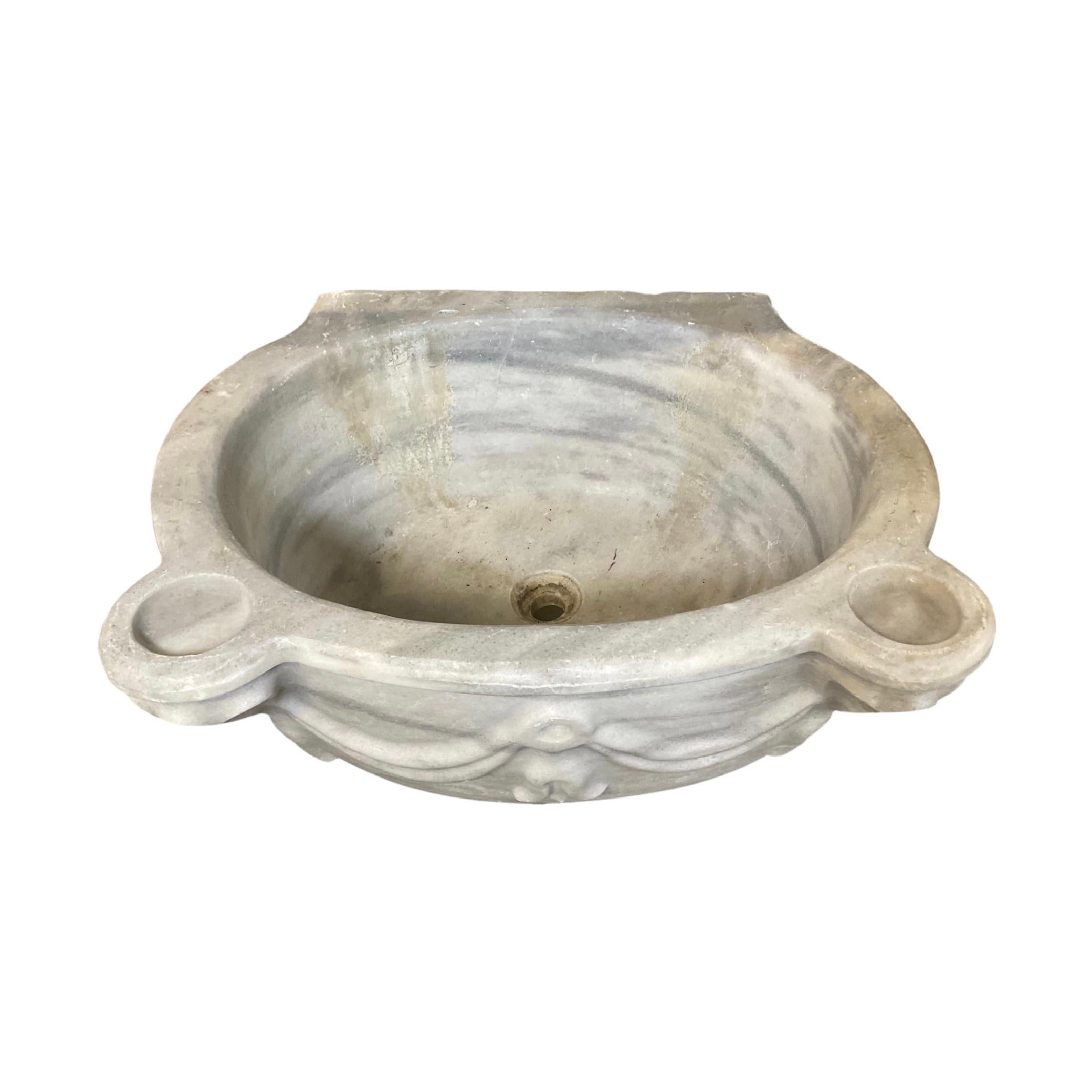 This stunning French white marble sink is an exact replica of the ones installed in palaces during the 18th century. Its timeless look and classic design will easily elevate the style of any bathroom.