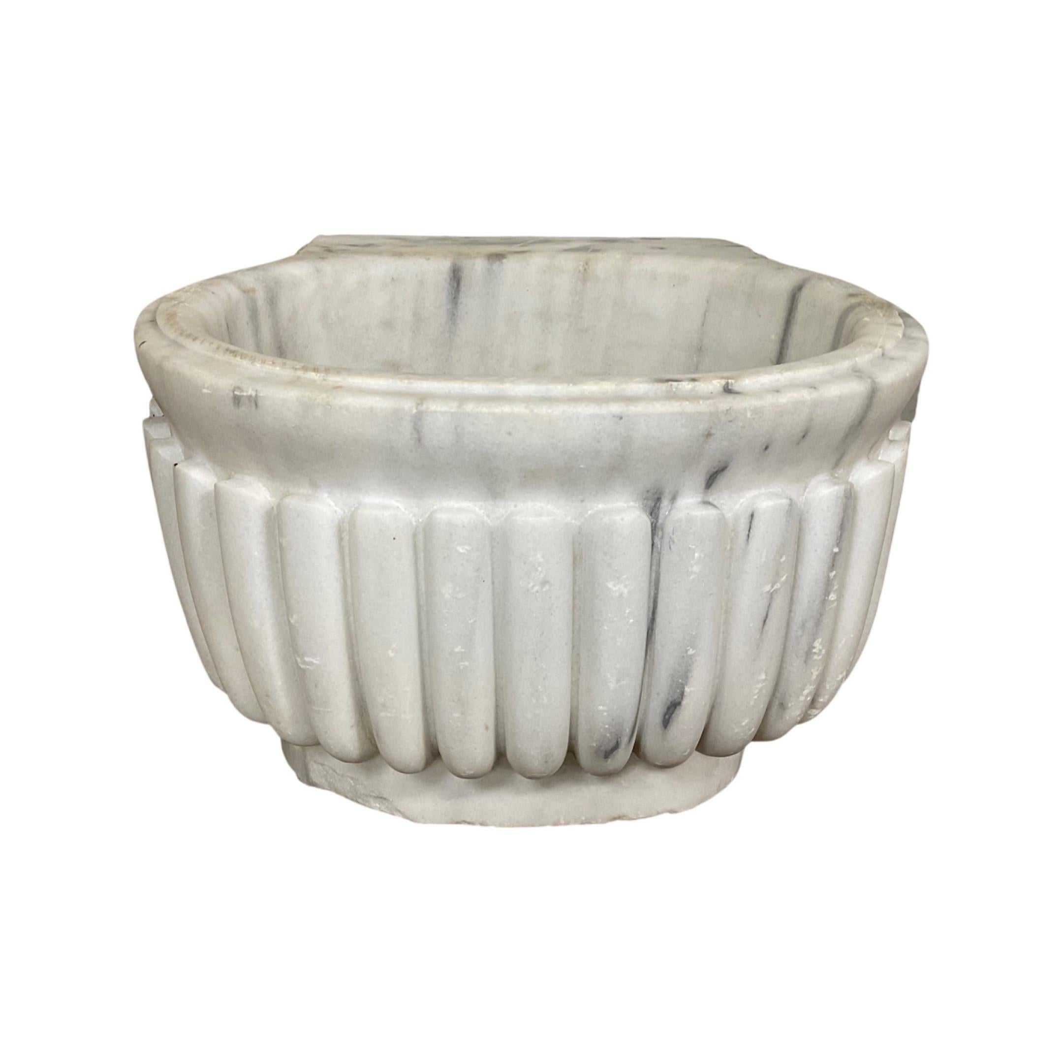 This French White Marble Sink is a timeless piece from the 18th century. It is sure to be an elegant key feature of any home with its timeless design and luxury white marble material. Add a classic touch to your home with this one-of-a-kind sink.