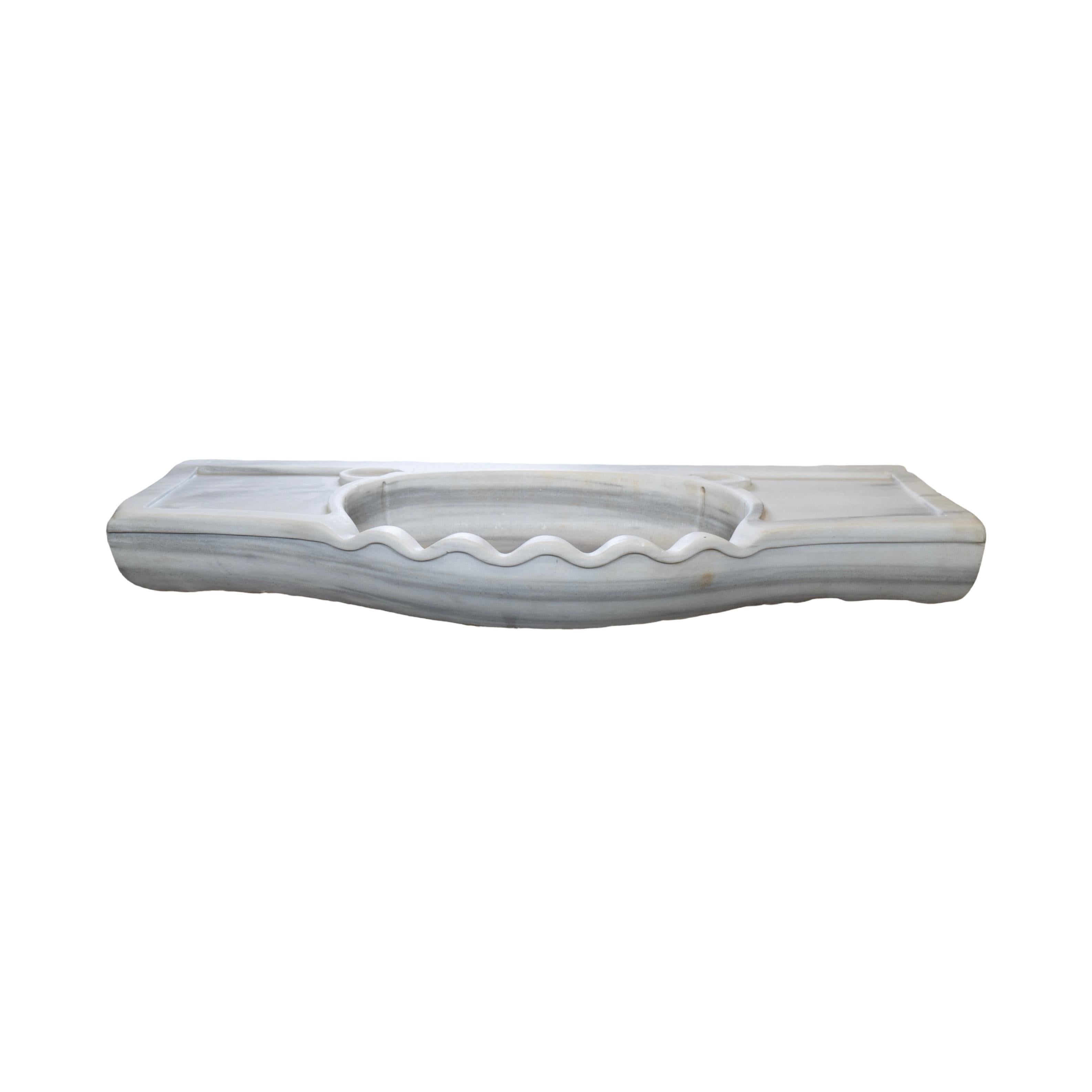This French White Carrara Marble Sink is a timeless design from the 18th century. Featuring a pristine white marble exterior and sleek design, it's an exquisite addition to any bathroom or kitchen. It's an ideal choice for those looking for an