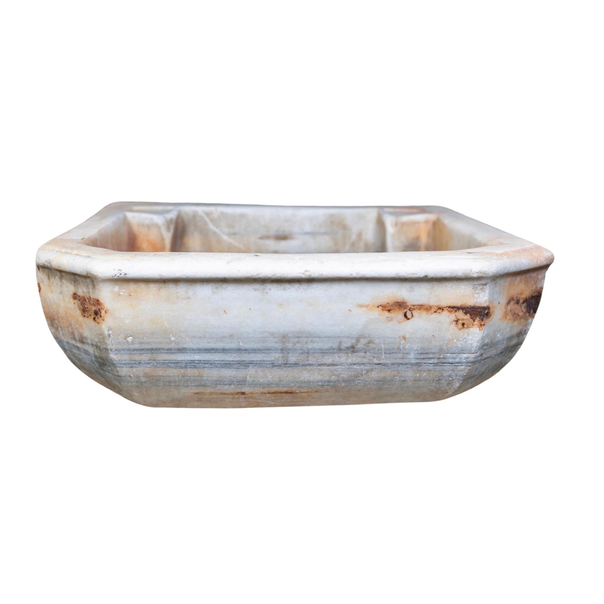 This French white marble sink is an 18th century construction from France using natural marble, offering superior quality and lasting durability. Its unique aesthetic and elegant design make it an ideal upgrade for modern kitchens. Its timeless
