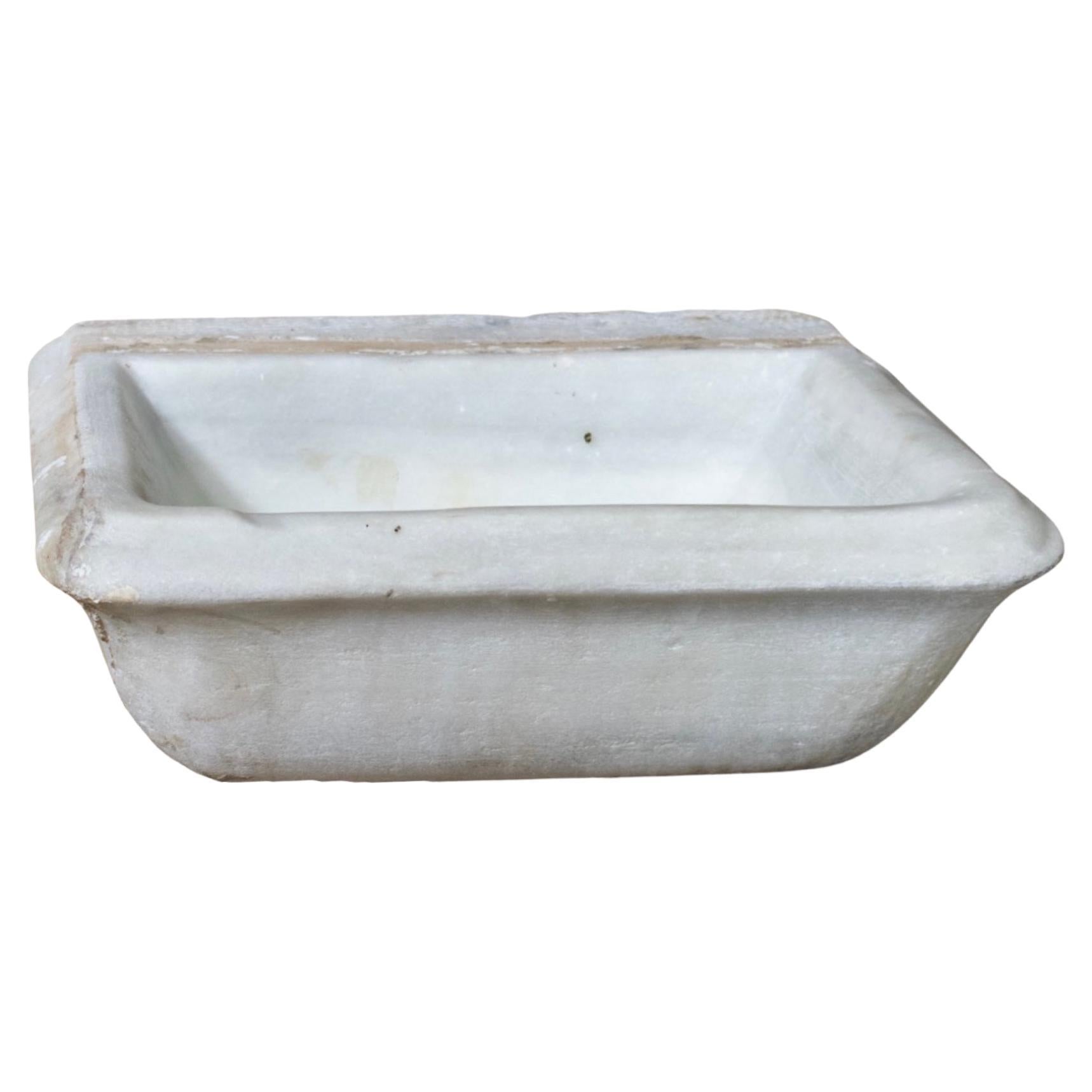 Small sink made out of white Marble stone. Originates from France. Circa, 19th c.