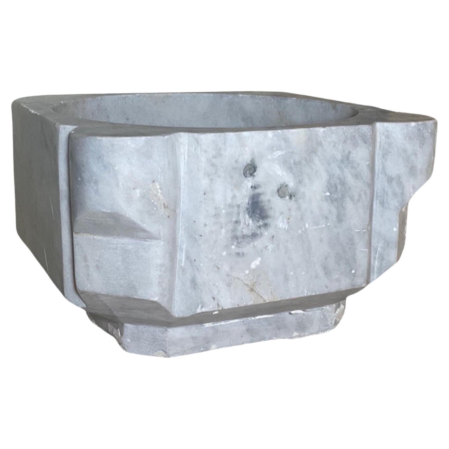 This 18th-century French white marble sink is a timeless, elegant addition to any bathroom. Its all-natural marble material is exquisitely crafted and durable enough to endure the daily wear and tear of bathroom use. The opulent marble texture