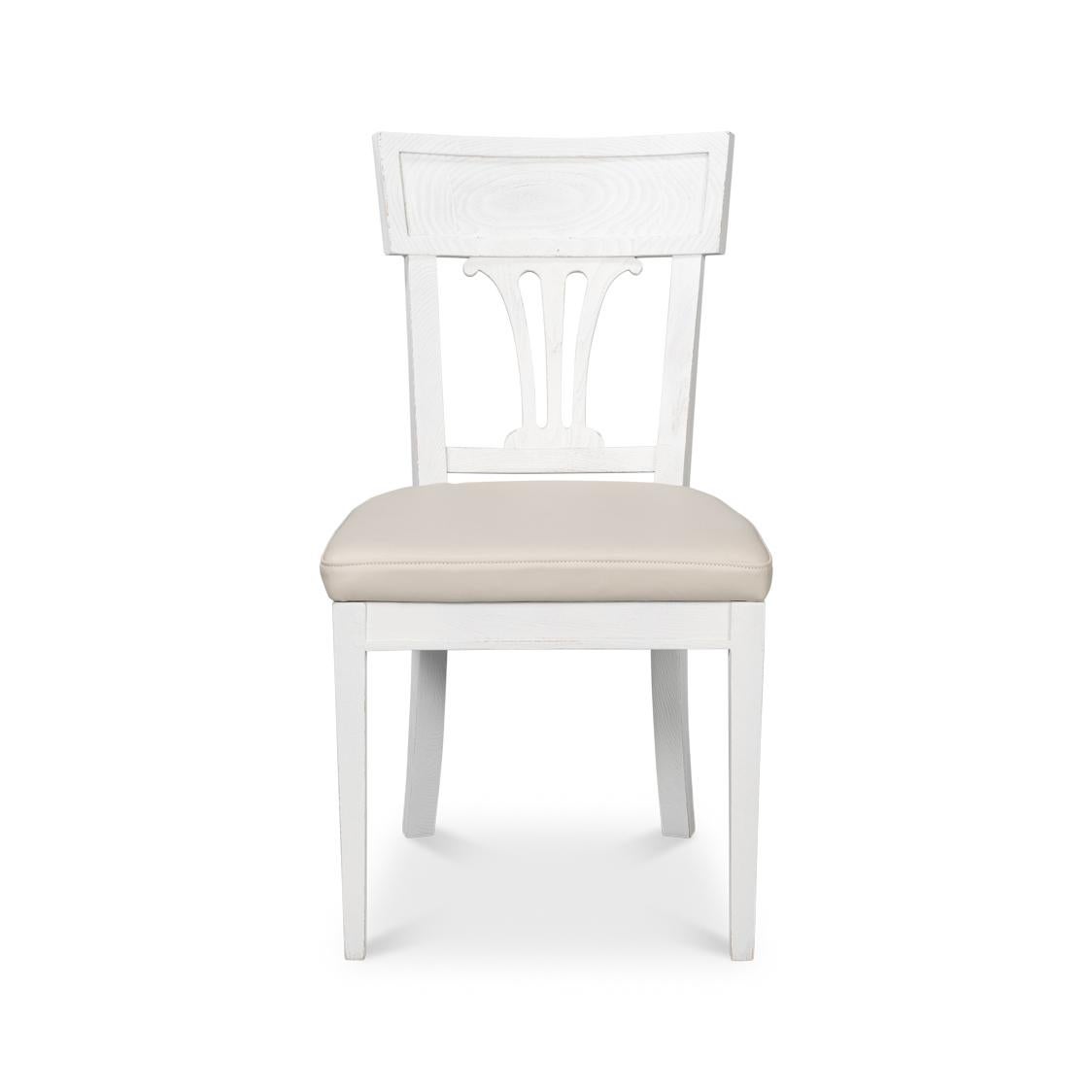 Featuring a beautifully painted white beechwood frame, this chair exudes refined French Directoire-inspired charm. The seat is upholstered in soft off-white leather, providing a luxurious touch while ensuring exceptional comfort for long dinners or