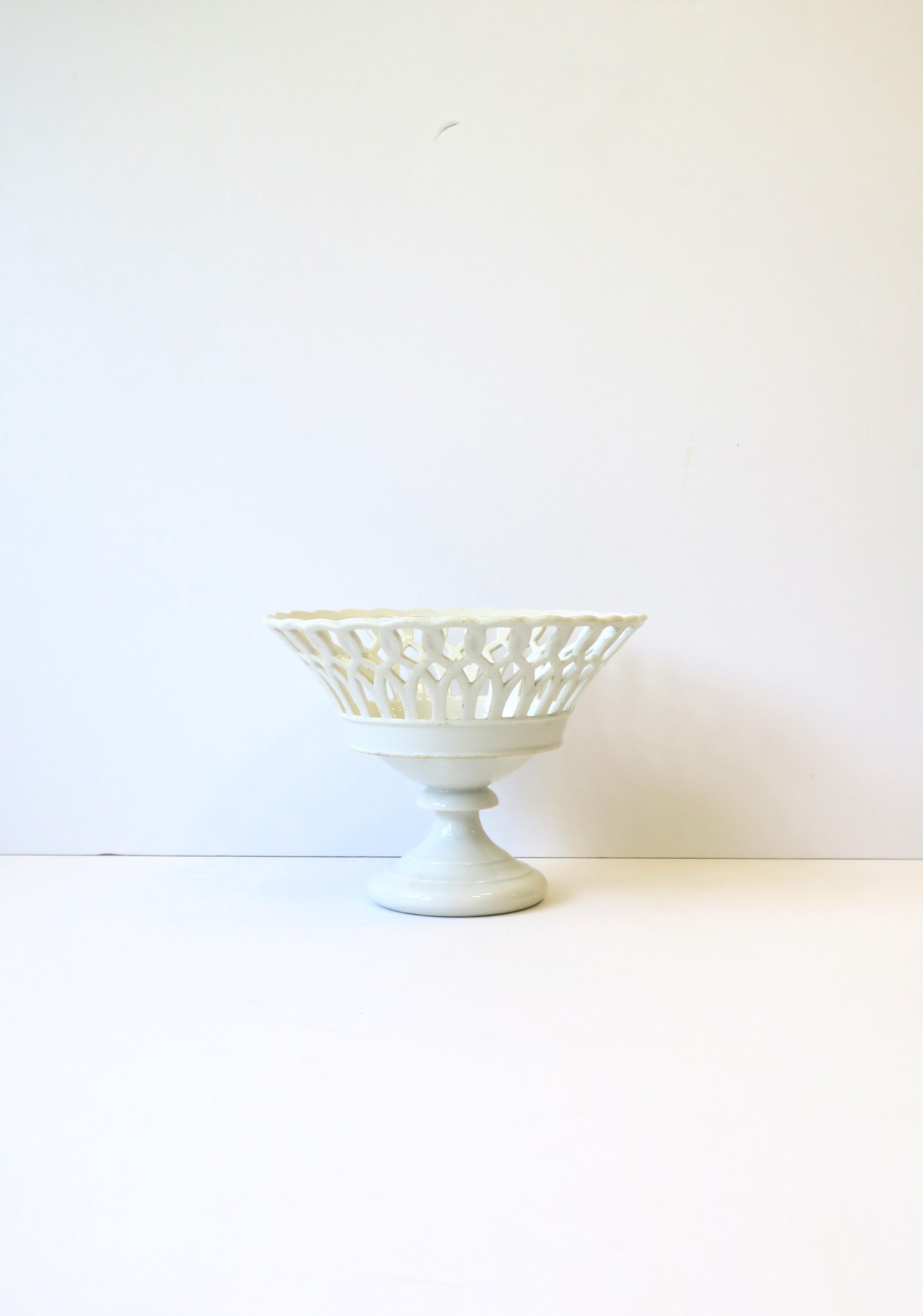 A French round pierced white Paris Porcelain compote basket tazza bowl in the Empire style, circa late 19th century, France. Great as a standalone piece or to hold fruits, vegetables, etc. Piece is a nice size. Dimensions: 9.25