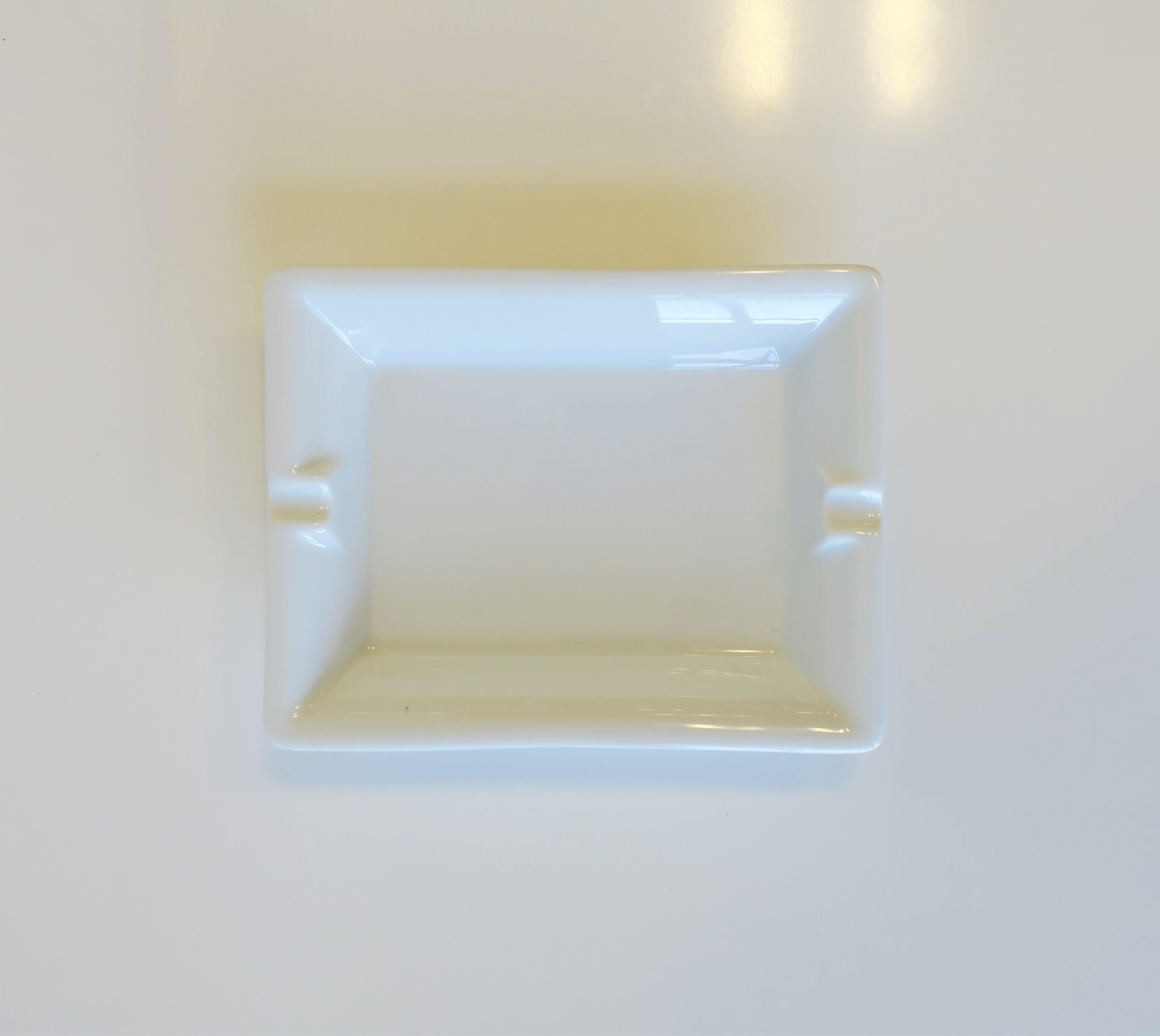 A French white porcelain tray vide-poche (catch-all) or ashtray, circa mid to late-20th century, France. A great standalone piece or tray to hold jewelry (as demonstrated) or other items on desk, vanity, nightstand, end table, etc. Marked on bottom
