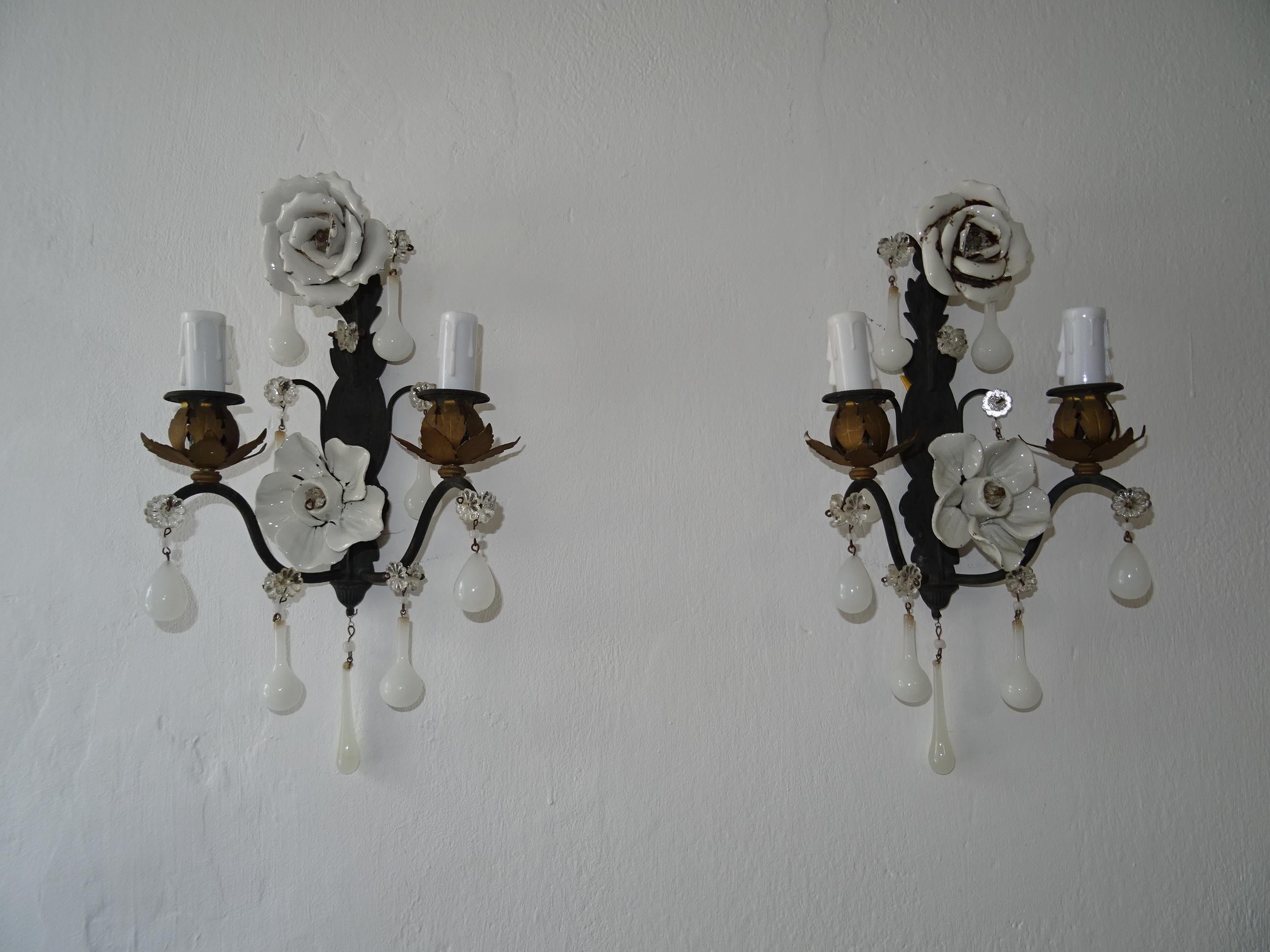 Housing two lights each. These will be rewired with certified US UL sockets for the USA and appropriate sockets for all other countries and ready to hang. Adorning big handmade white porcelain roses and flowers. Black metal with gold accents.