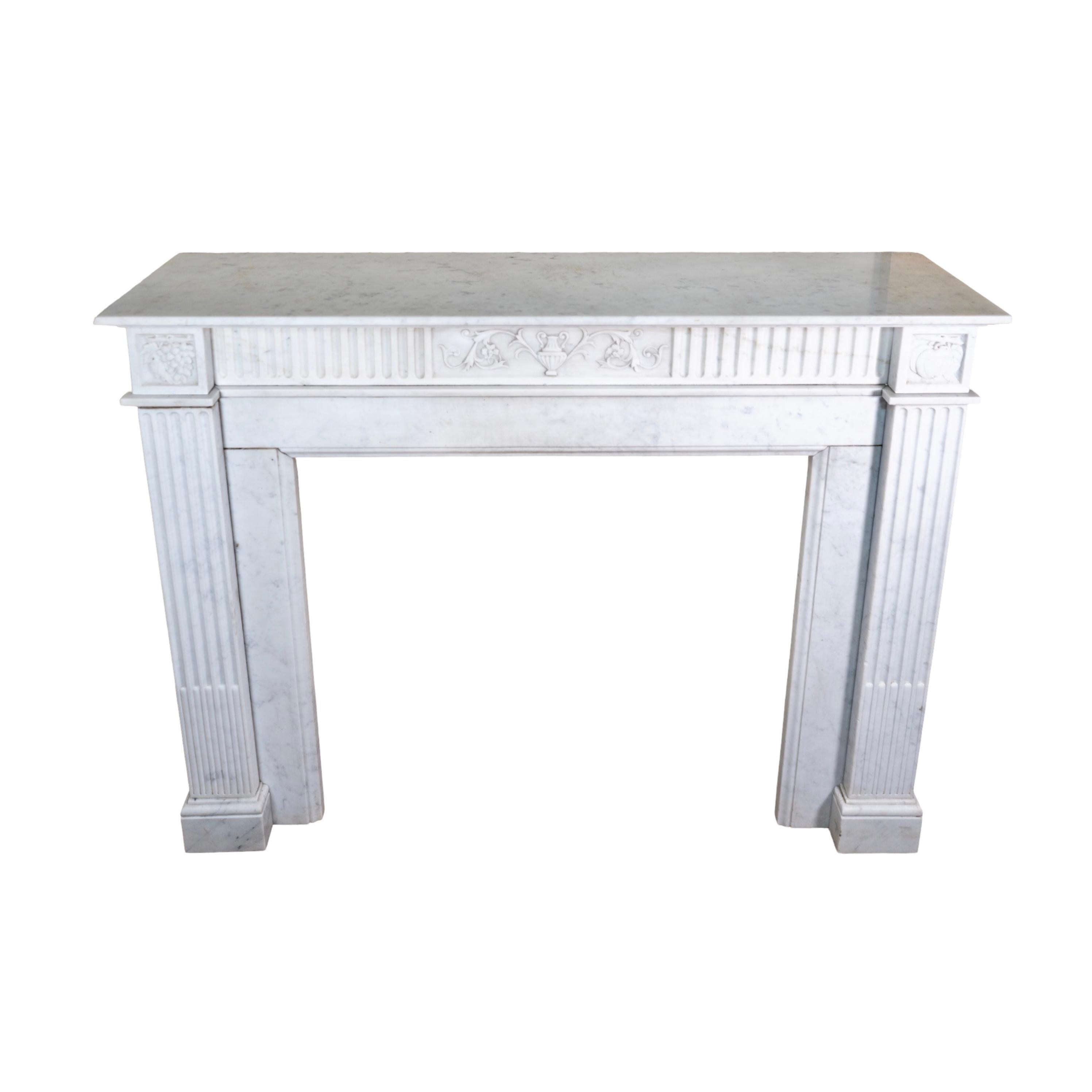 This elegant French Marble Mantel is a stunning antique, originating from France circa 1880. Its timeless beauty is crafted with premium white veined Carrara marble, perfect for adding a touch of sophistication to any room. 