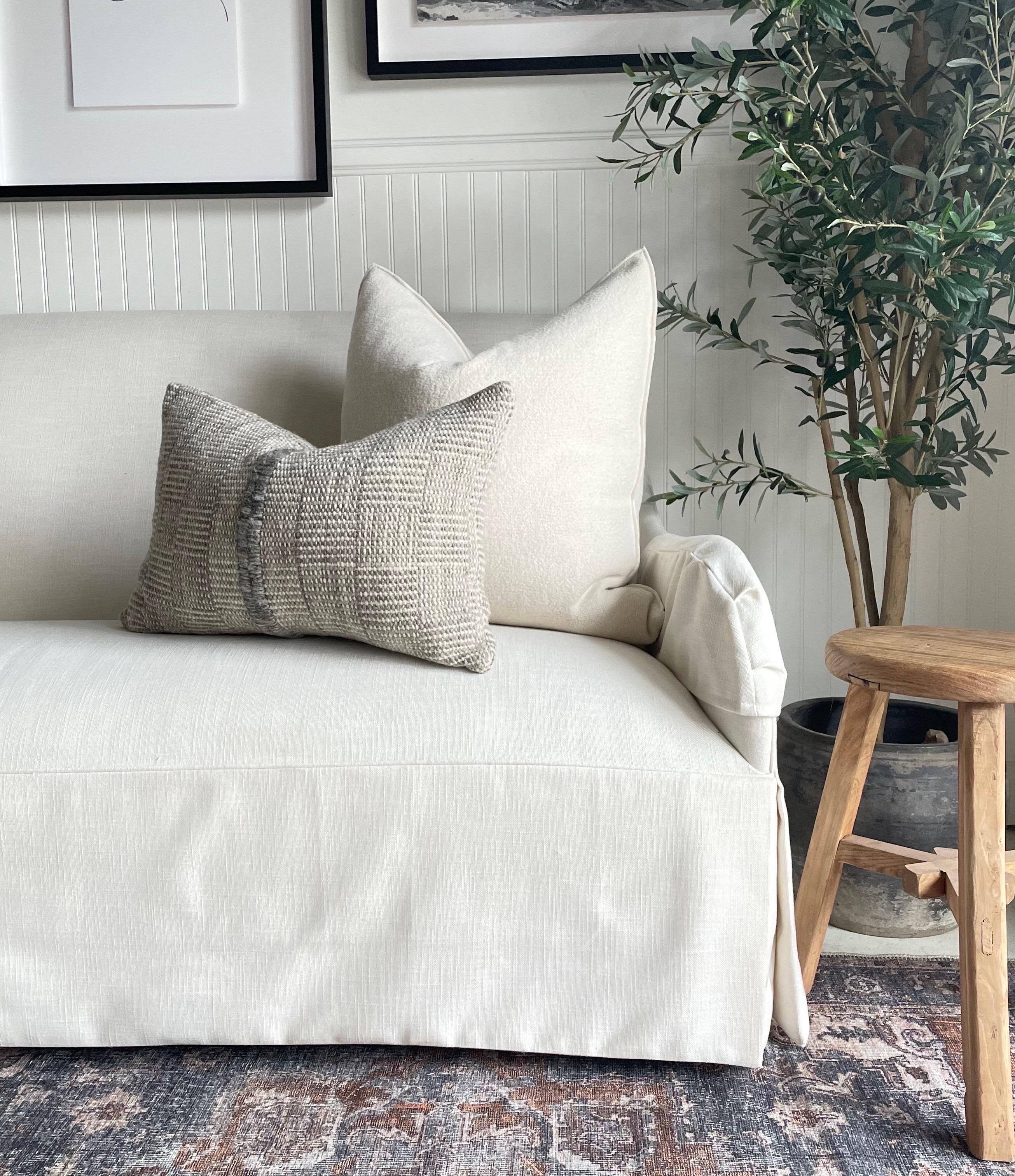 ustom wool blend accent pillow with down insert Color: Blanc, a nubby boucle style pillow with a stitched edge, metal zipper closure. Our pillows are constructed with vintage one of a kind textiles from around the globe. Carefully constructed with