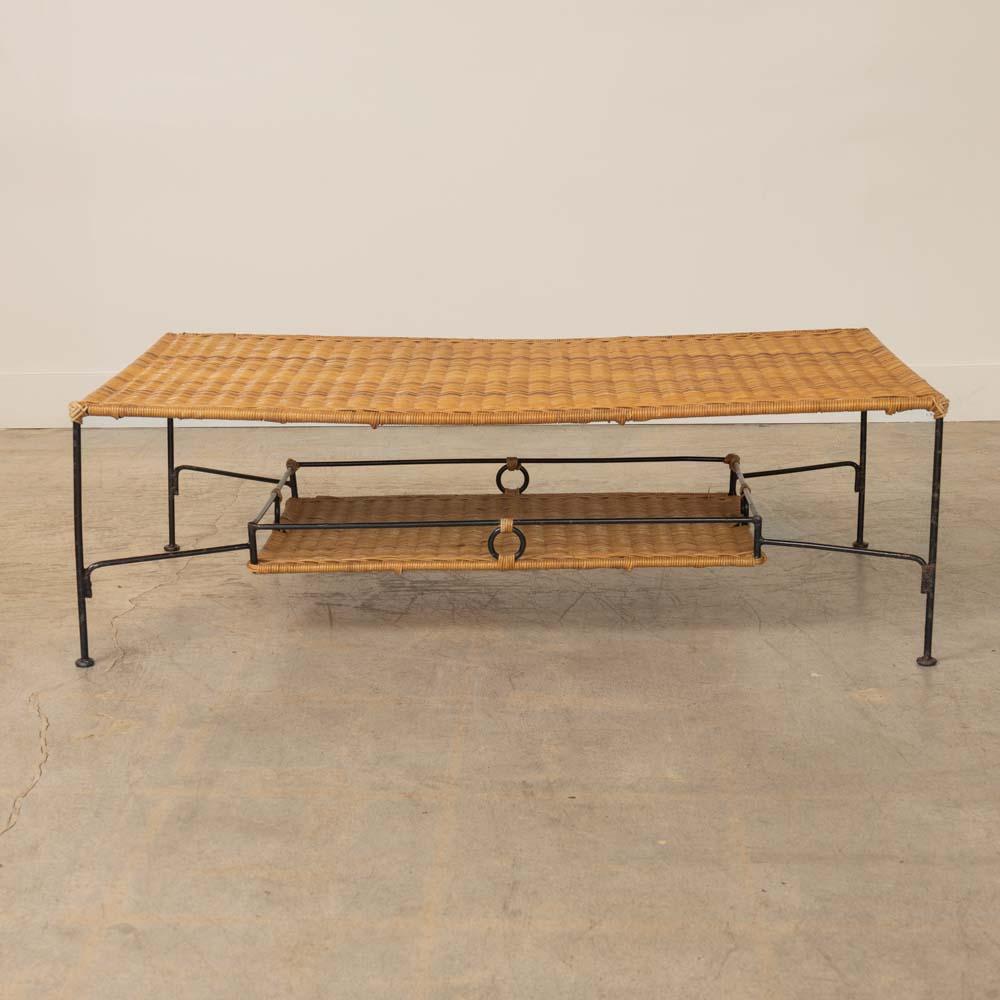 Great rectangular two-tier wicker and iron coffee table from France, 1950s. Iron frame wrapped in wicker with woven wicker top and lower shelf. Original iron shows nice age and patina. Original wicker has minor areas of fray and a few corner areas