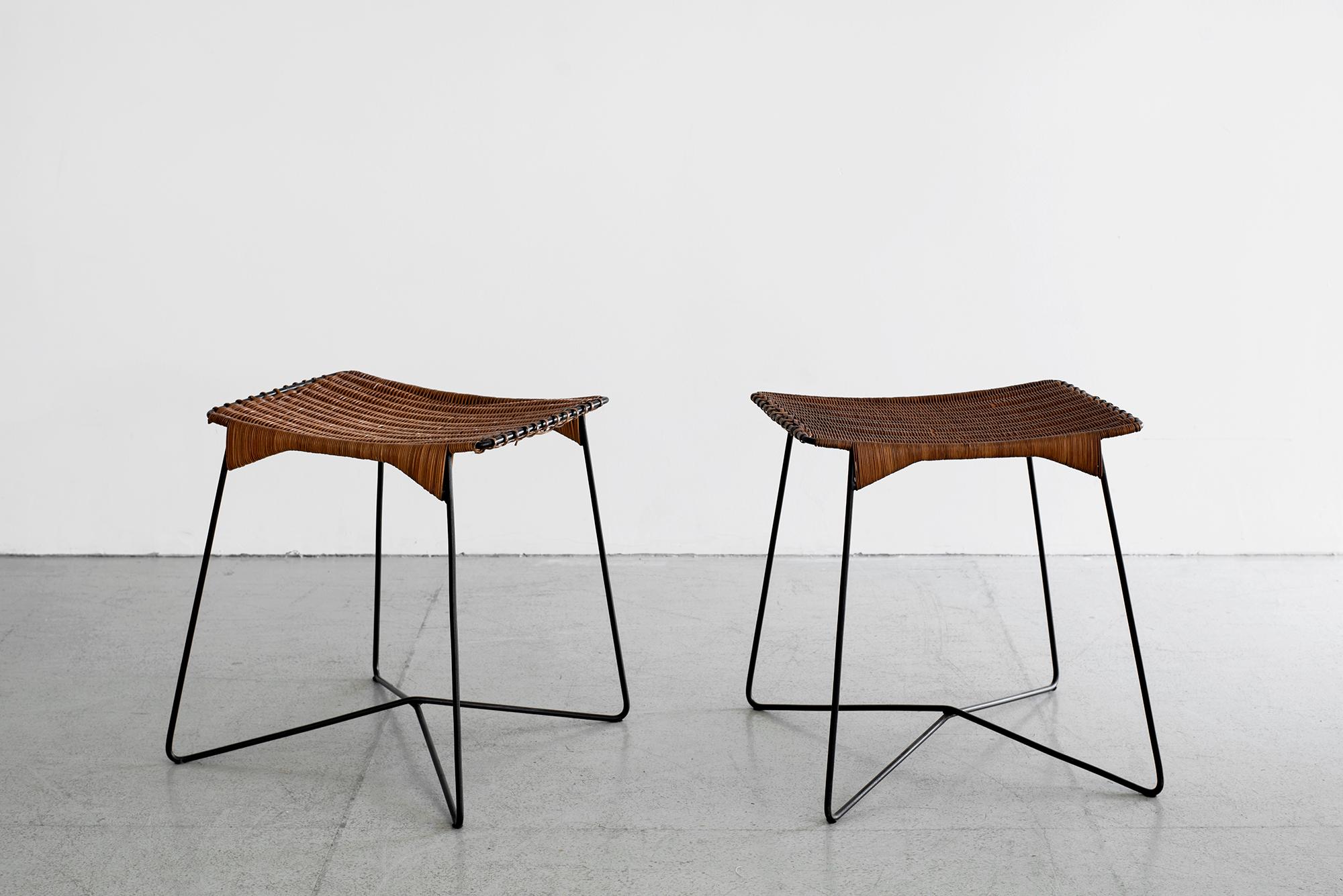 Pair of French wicker stools with iron base and wicker whip stitch seat tops. 

Total dimensions: 16.75