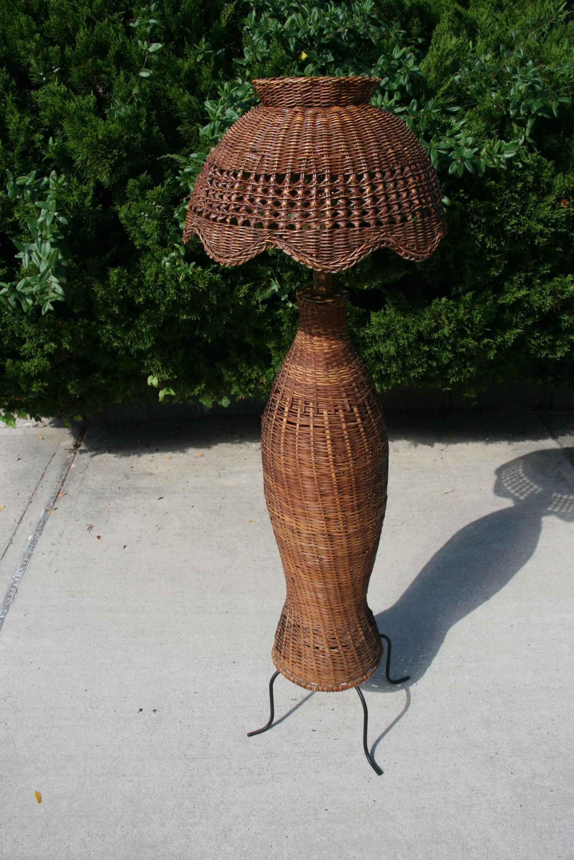 3-779 French wicker floor lamp with metal base 
Rewired
Takes one 100 watt Edison based bulb.