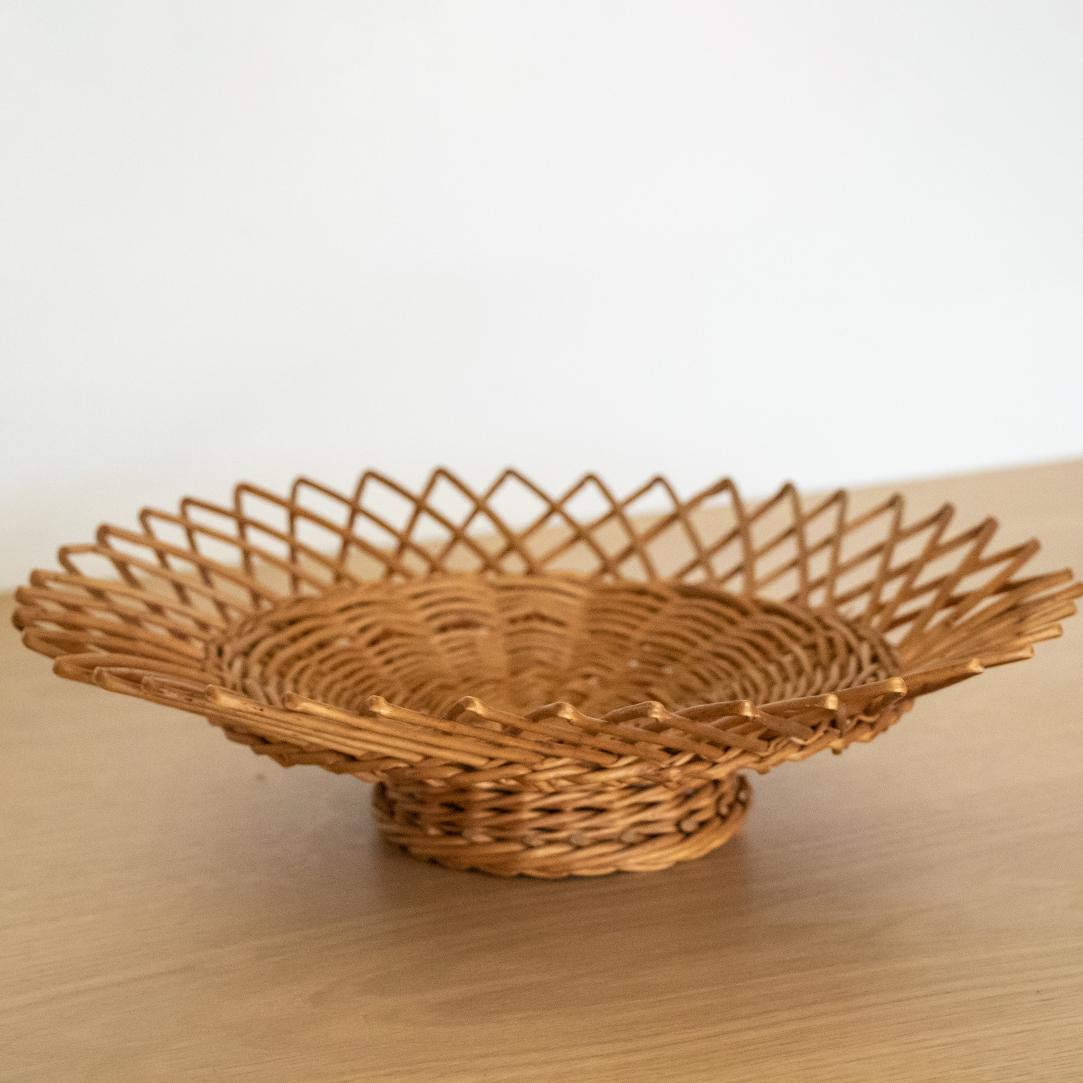Vintage wicker bowl with small-footed base, perfect for display or holding fruit. In great original condition from France.