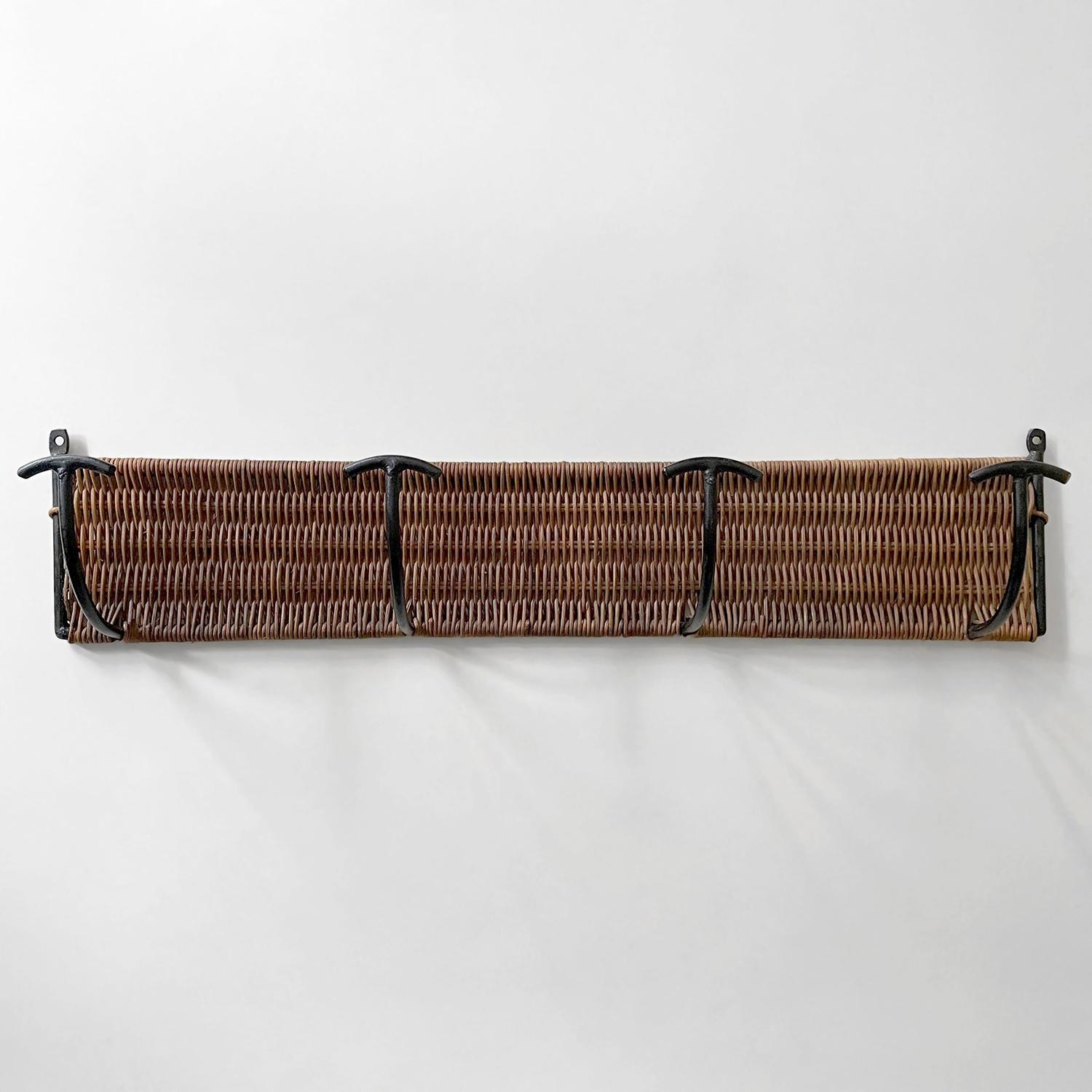 French wicker and iron wall hook
France, circa 1950’s
Wicker intricately woven around solid iron frame
Natural color variations
Beautiful form and function
Patina from age and use
Last photo is for reference only
We have a large selection of antique