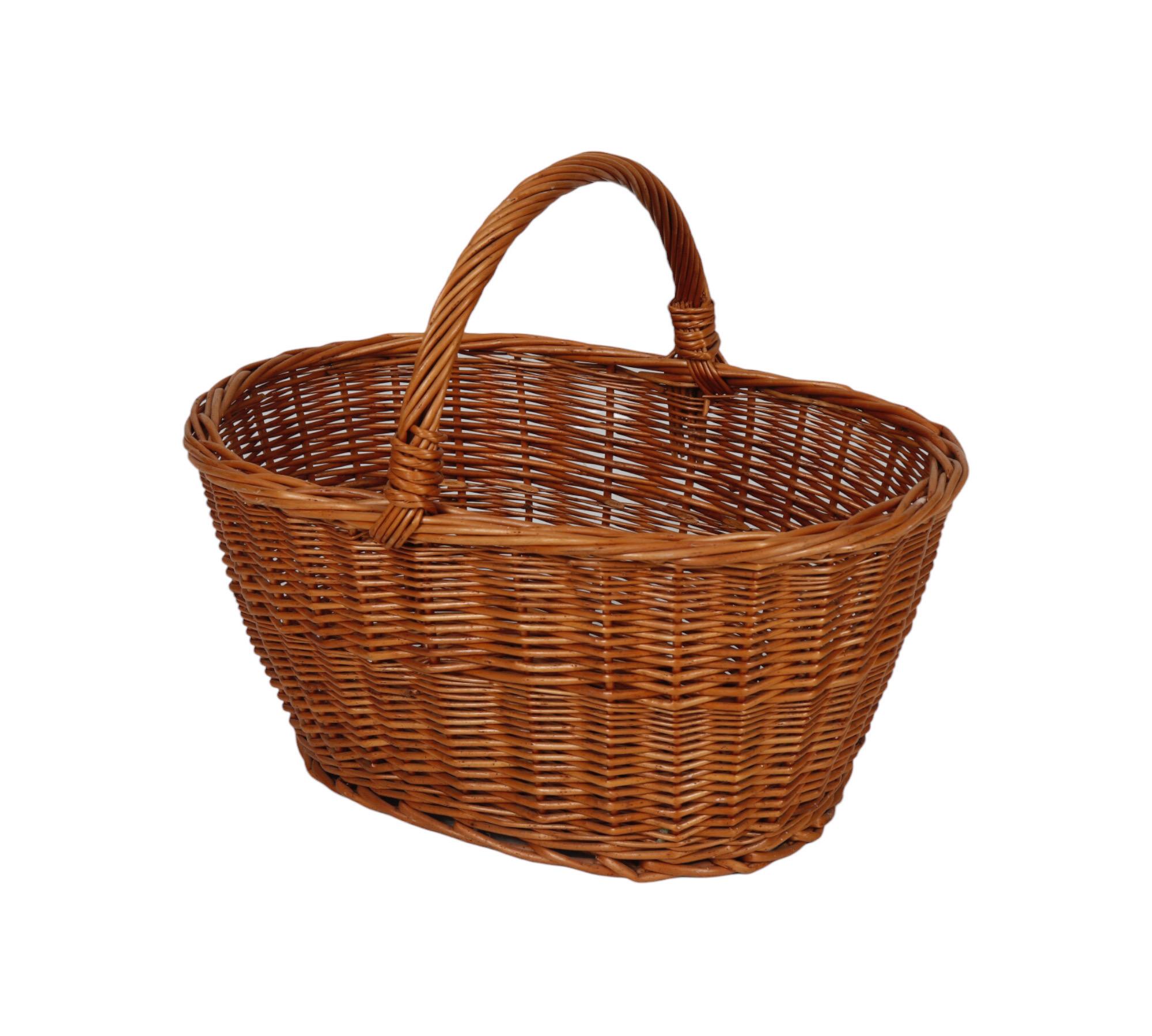 A classic French oval shaped wicker shopping basket. The twisted handle is secured to a twisted braided edge.
