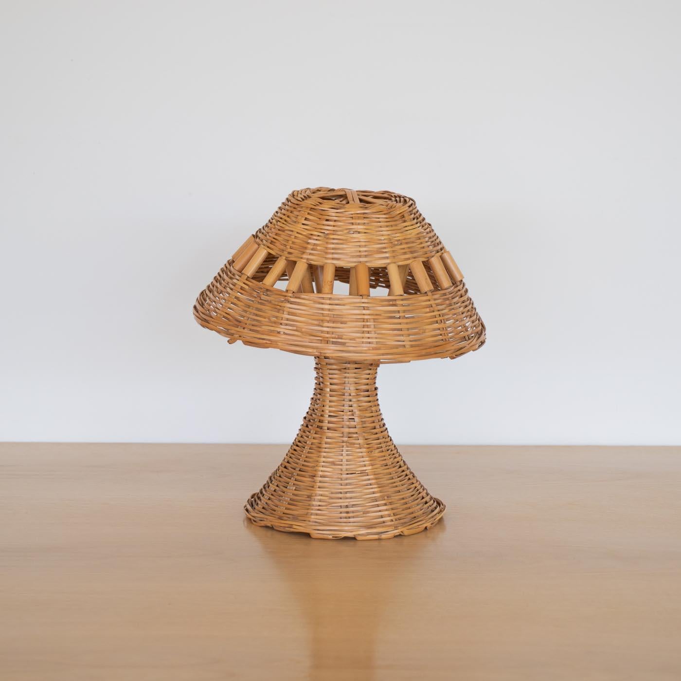 Lovely wicker table lamp from France, 1950's. Wicker shade with bamboo detail and round wicker base woven to form one piece. Newly rewired. Removable socket fits securely into wicker base underside. Takes one E12 base bulb, 25 W or higher using LED.